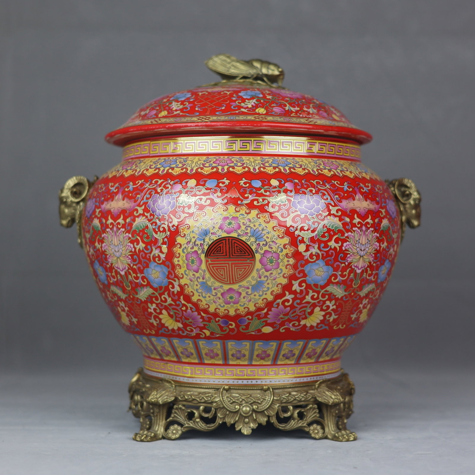 A Rare Red Ground Enamel Inlaid Bronze Lotus Pattern Sheep-Ears Jar with Cover: A Rare Red Ground Enamel Inlaid Bronze Lotus Pattern Sheep-Ears Jar with Cover,Qing Dynasty,China,Qianlong Four-Character Mark,Size:15.4inx11.4in 红地珐琅彩嵌໢