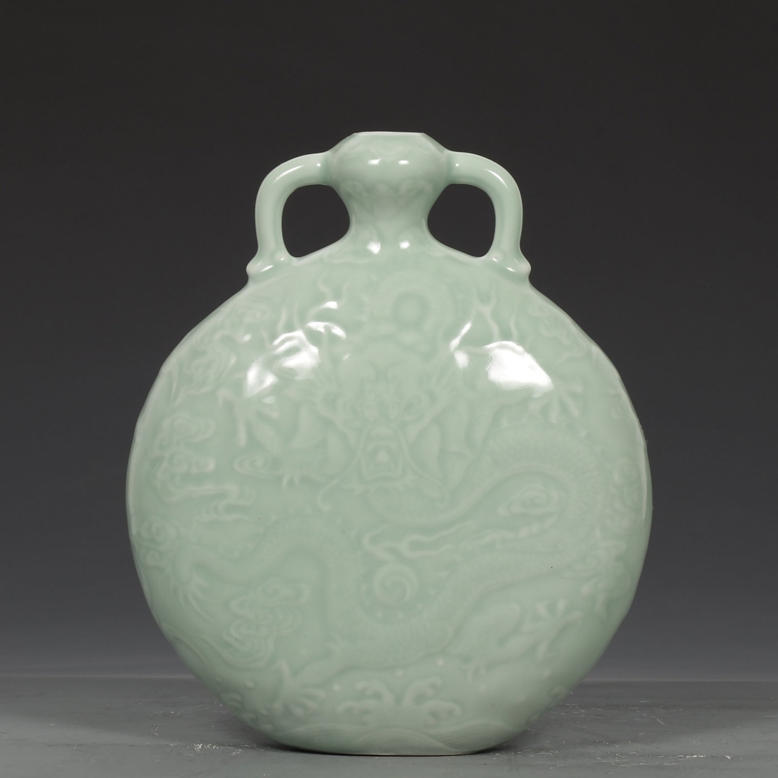 An Exquisite Celadon Glazed Auspicious Cloud and Dragon Pattern Double-Ears Vase: An Exquisite Celadon Glazed Auspicious Cloud and Dragon Pattern Double-Ears Vase,Qing Dynasty,China ,Qianlong Six-character Mark,Size:8.7inx7.1in 粉青釉祥云龙ಬ
