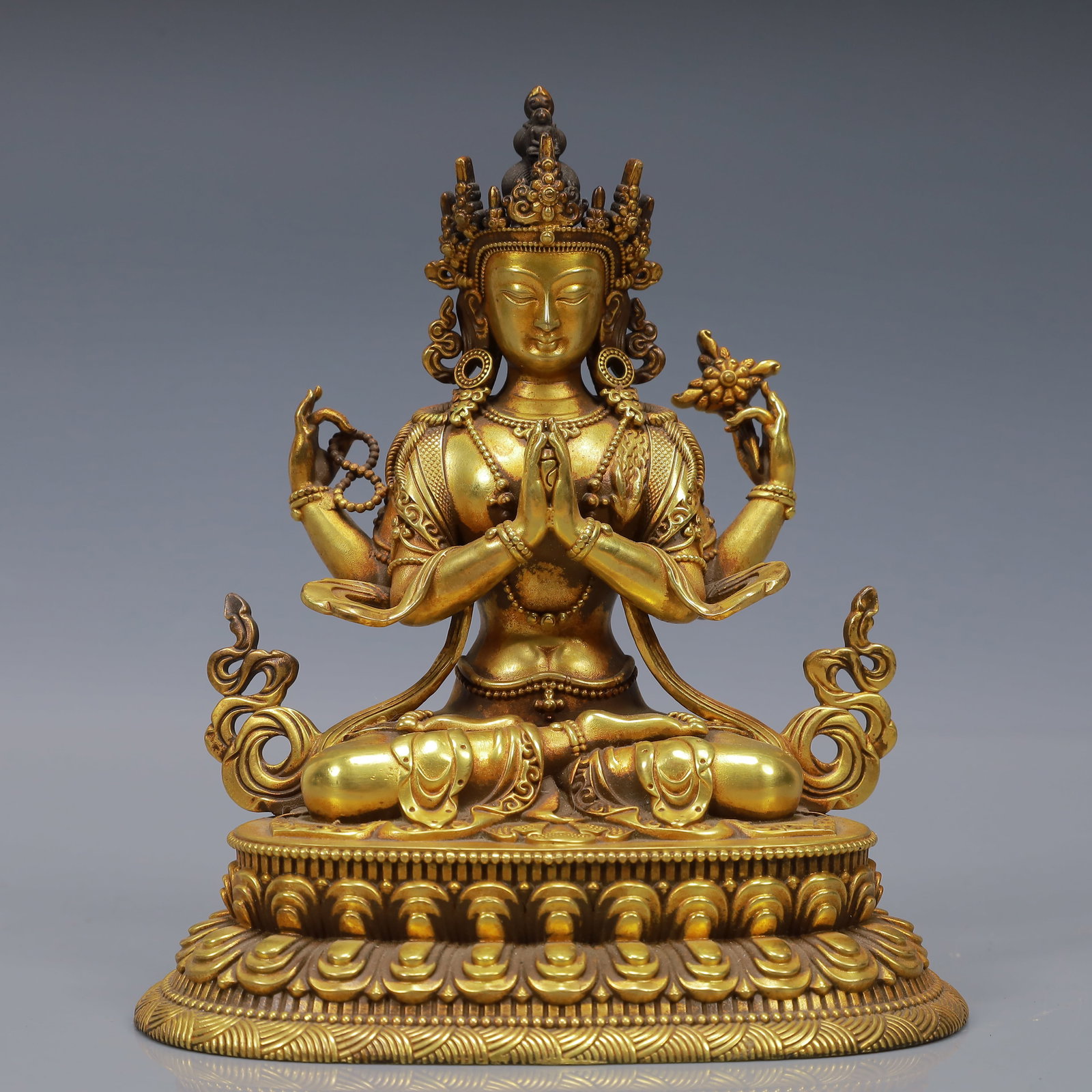 An Exquisite Gilt Bronze Statue of Four-Armed Guanyin: An Exquisite Gilt Bronze Statue of Four-Armed Guanyin,Ming Dynasty, China,Yongle Six-character Mark,Size:5.1inx3.9inx5.9in,Weight:1500g 铜鎏金四臂观音像