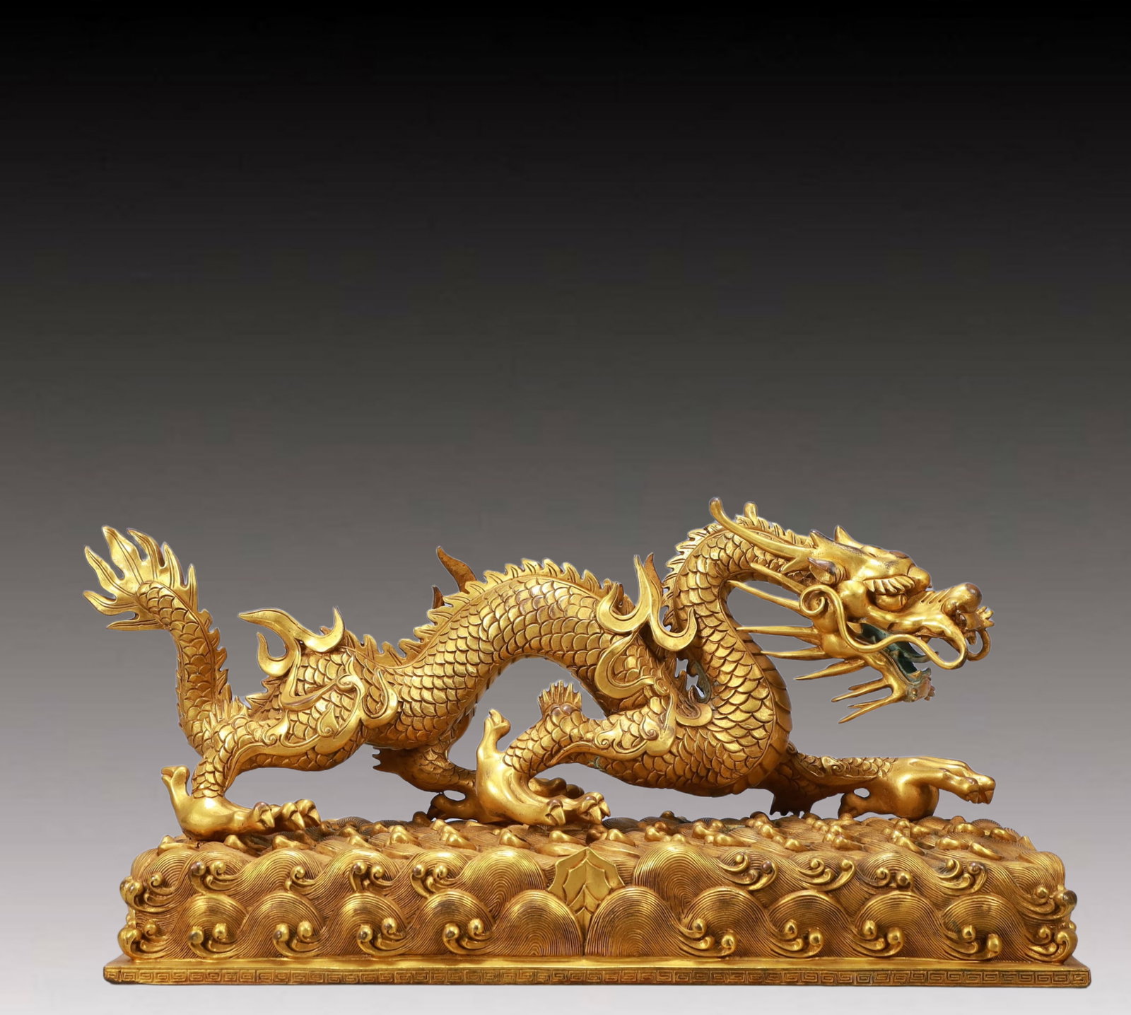 A Monumental Gilt Bronze Dragon Ornament: A Monumental Gilt Bronze Dragon Ornament,Ming Dynasty, China,Size:17.3inx6.3inx8.7in Weight:10300g 铜鎏金龙摆件,中国明代