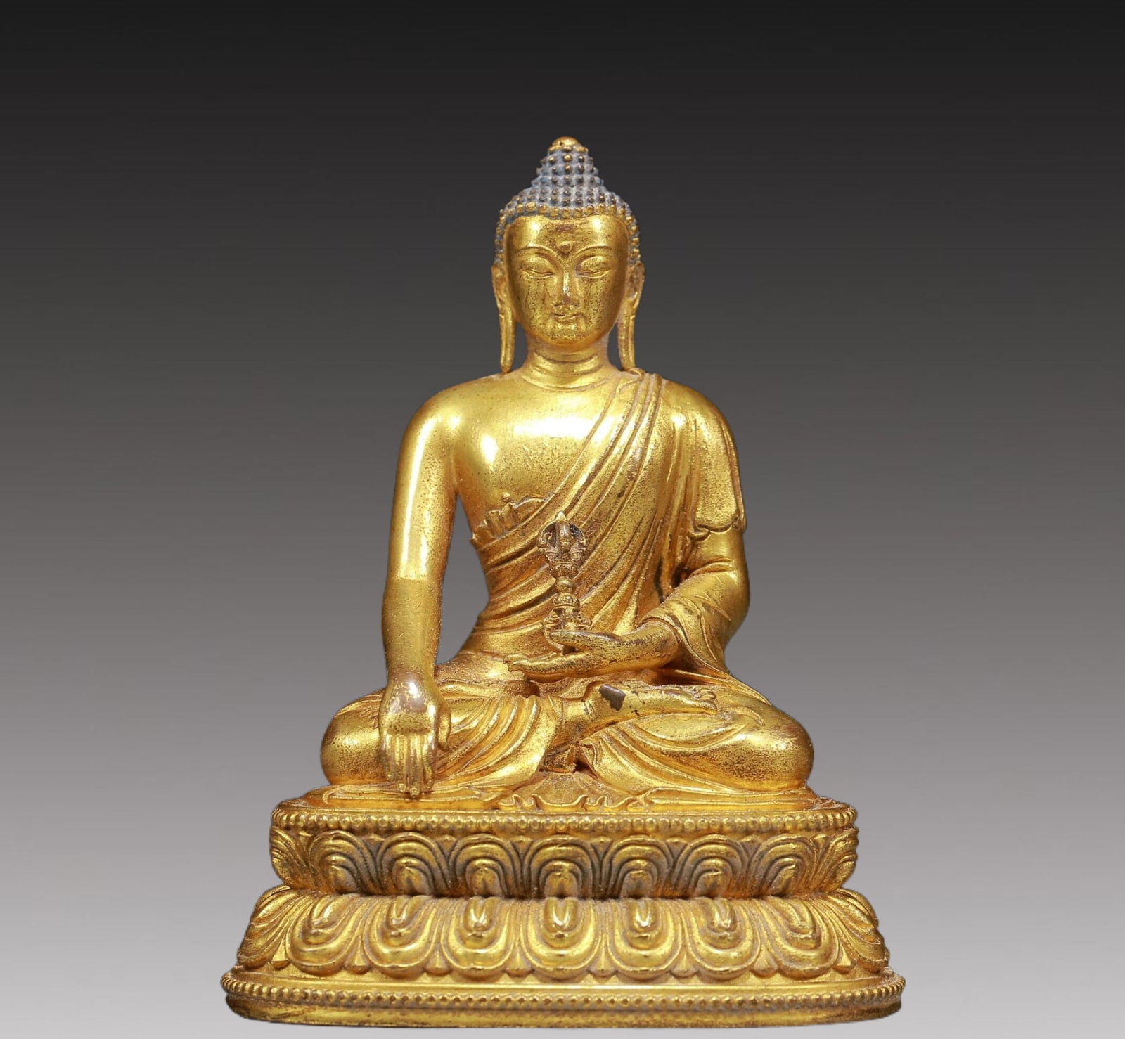 A Solemn Gilt Bronze Statue of Sakyamuni: A Solemn Gilt Bronze Statue of Sakyamuni,Ming Dynasty, China,Size:3inx2.2inx3.9in,Weight:370g 铜鎏金释迦摩尼像，明代