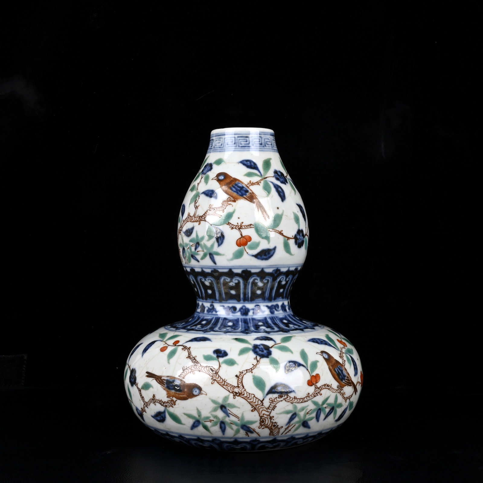 An Exquisite Wucai Flower and Bird Pattern Gourd-Shaped Vase: An Exquisite Wucai Flower and Bird Pattern Gourd-Shaped Vase,Ming Dynasty,China,Size:10.2inx7.9in 五彩花鸟纹葫芦瓶,中国明代