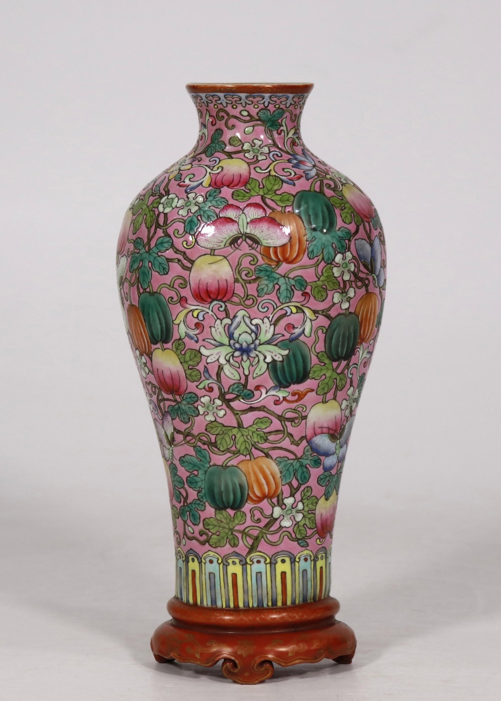 An Exquisite Ruby Red-Glazed Famille-Rose Melon and Fruit Pattern Vase: An Exquisite Ruby Red Glazed Famille-Rose Melon and Fruit Pattern Vase,Qing Dynasty,China,Qianlong Six-character Mark,Size:8inx3.7in