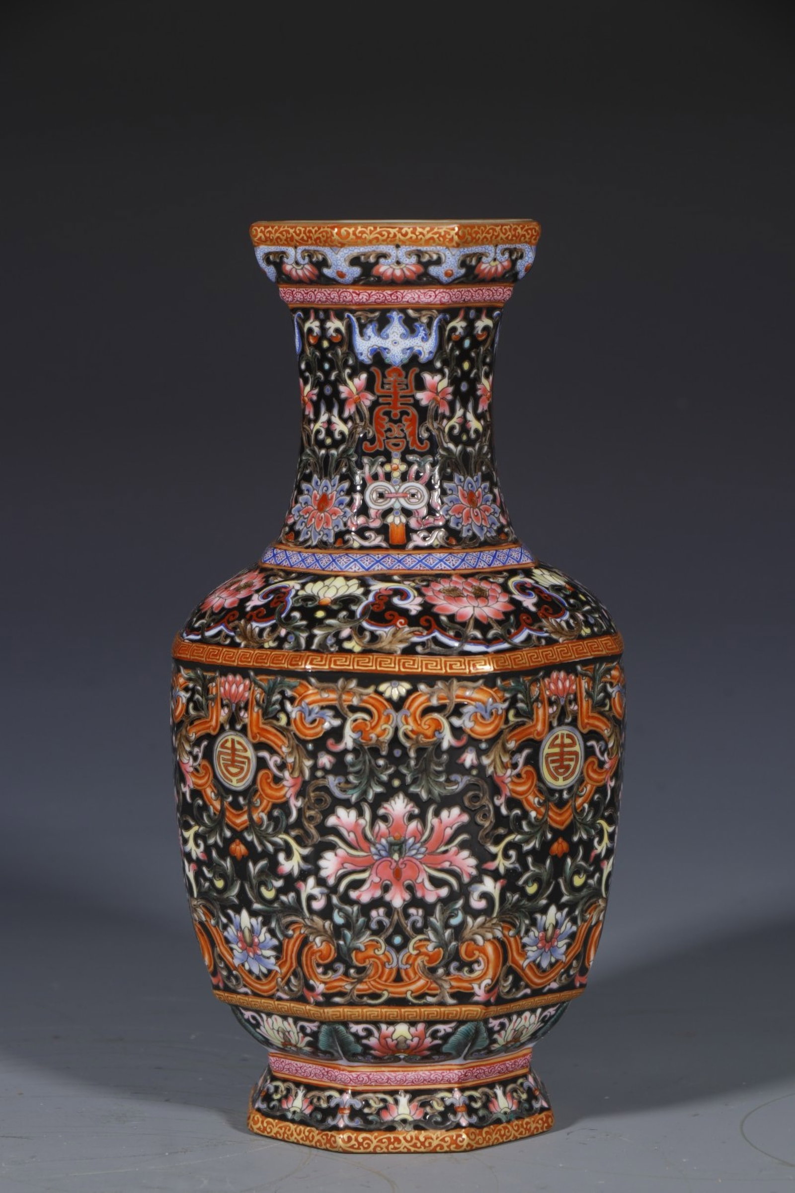 An Exquisite Black Ground Enamel Lotus Pattern Vase: An Exquisite Black Ground Enamel Lotus Pattern Vase,Qing Dynasty,China,Qianlong Four-character Mark,Size:8.5inx3in 黑地珐琅彩缠枝莲纹瓶,