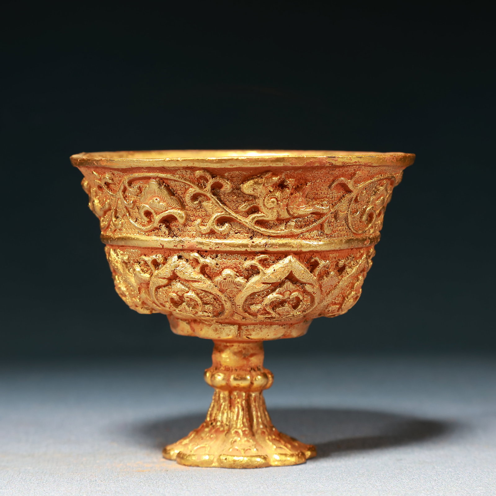 An Exquisite Gilt Bronze Lotus and Auspicious Beast Pattern Stem Cup: An Exquisite Gilt Bronze Lotus and Auspicious Beast Pattern Stem Cup,Tang Dynasty,China,Zhenguan Four-character Mark,Size:3.9inx3.7in,Weight:500g 铜鎏金缠枝莲ண
