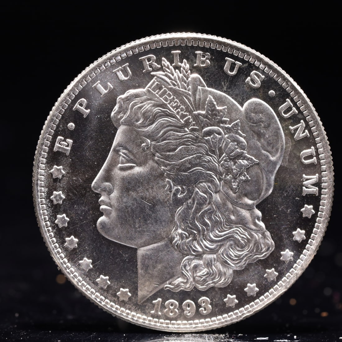USA Morgan Dollar 1893 Coin: Obv: profile bust with date below and E PLURIBUS UNUM legend and stars around. Rev: eagle with In God we trust above within wreath with UNITED STATES OF AMERICA ONE DOLLAR legend. IN GOD WE TRUST / LI