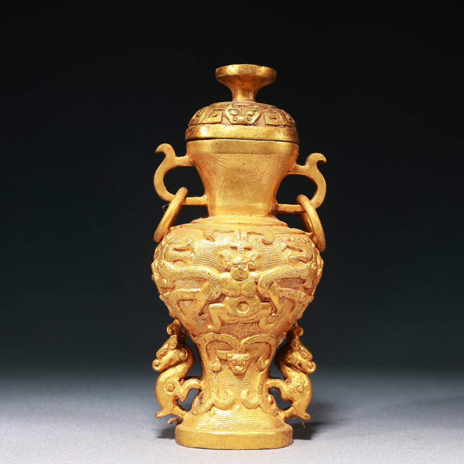 An Exquisite Gilt Bronze Auspicious Beast Dragon Pattern Double-Ears Bottle: An Exquisite Gilt Bronze Auspicious Beast Dragon Pattern Double-Ears Bottle,Qing Dynasty,China,Size:3.1inx2.6inx6.7in,Weight:850g 铜鎏金瑞兽龙纹双೑