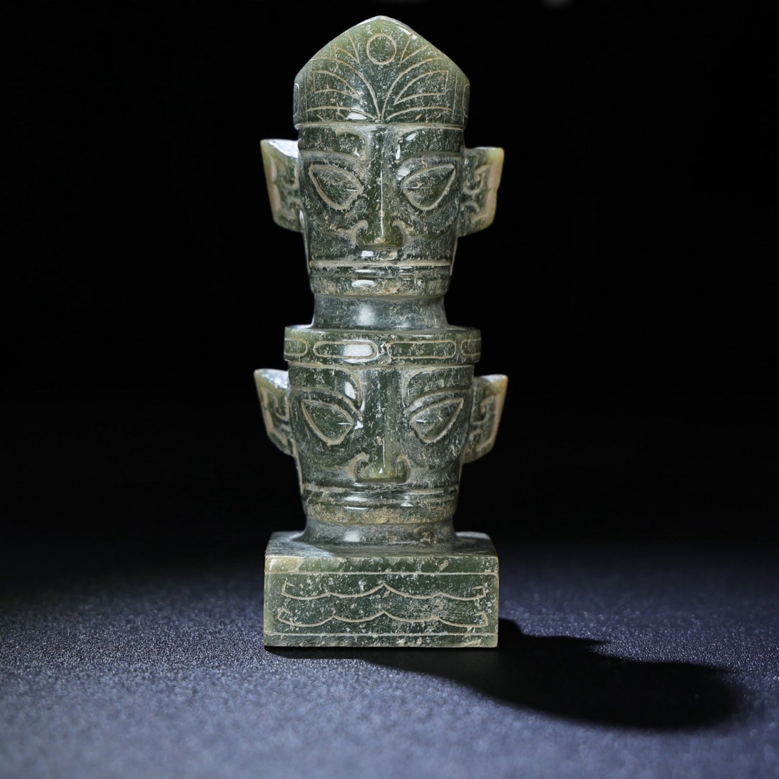 An Exquisite Archaic Jade Figure-Face Pattern Ornament: An Exquisite Archaic Jade Figure-Face Pattern Ornament,Ancient Time,China,Size:124mmx52mmx38mm,Weight:394g 高古玉人面纹摆件,中国远