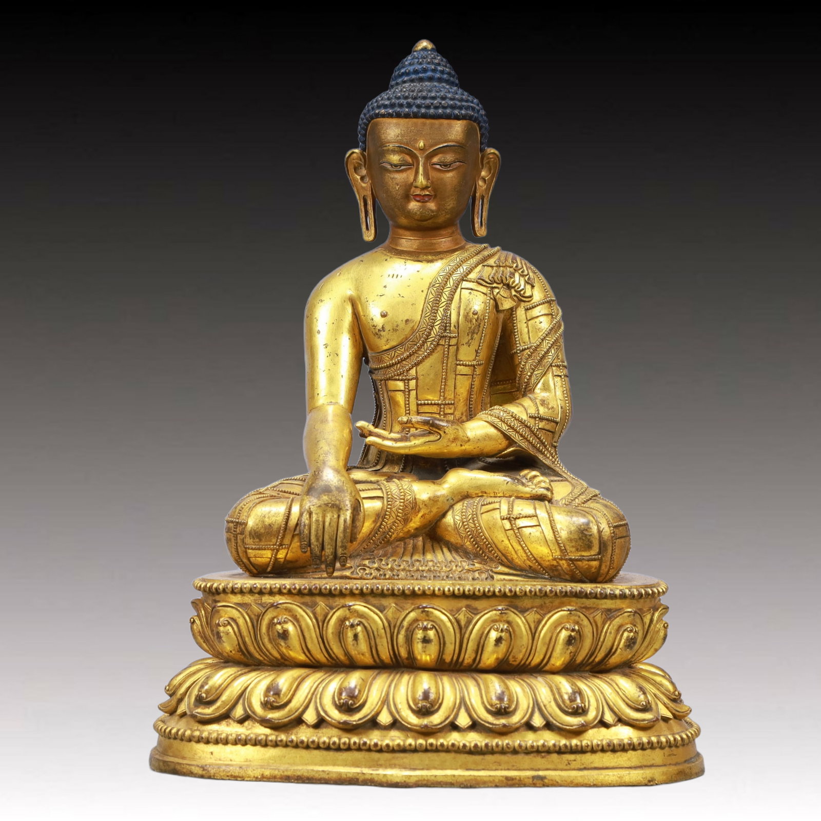 A Solemn Gilt Bronze Statue of Sakyamuni: A Solemn Gilt Bronze Statue of Sakyamuni ,Ming Dynasty, China,Size:9.4inx6.3inx13.4in Weight:6250g 铜鎏金释迦牟尼像,中国明代
