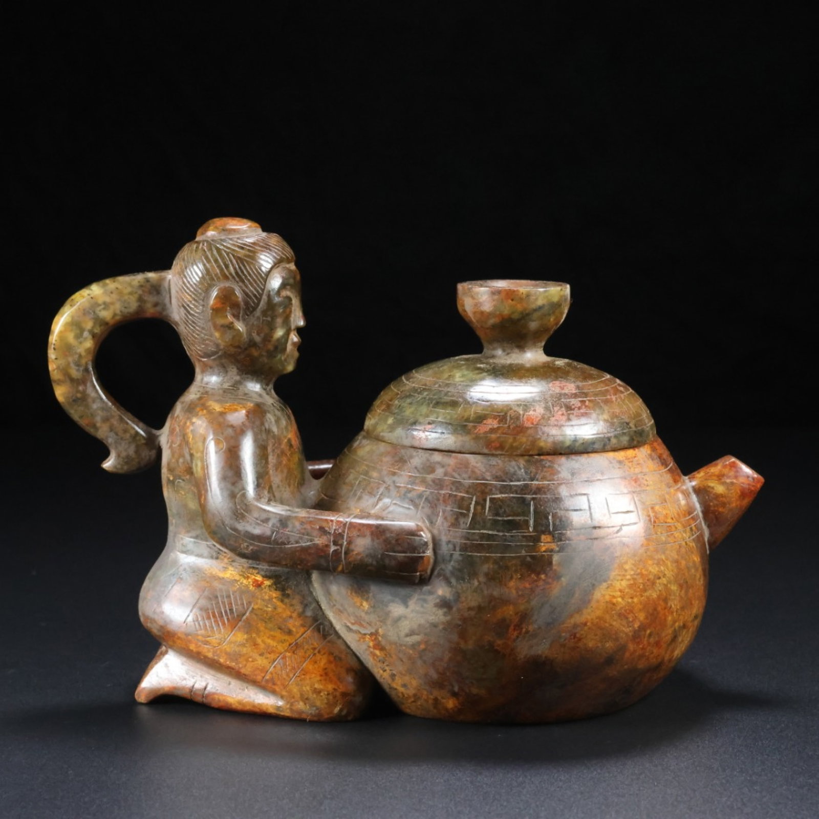 An Exquisite Archaic Jade Figure Pot: An Exquisite Archaic Jade Figure Pot,Ancient Time,China,Size:6.1inx3.9inx4.7in,Weight:1.203kg 高古玉人物壶,中国远古时期
