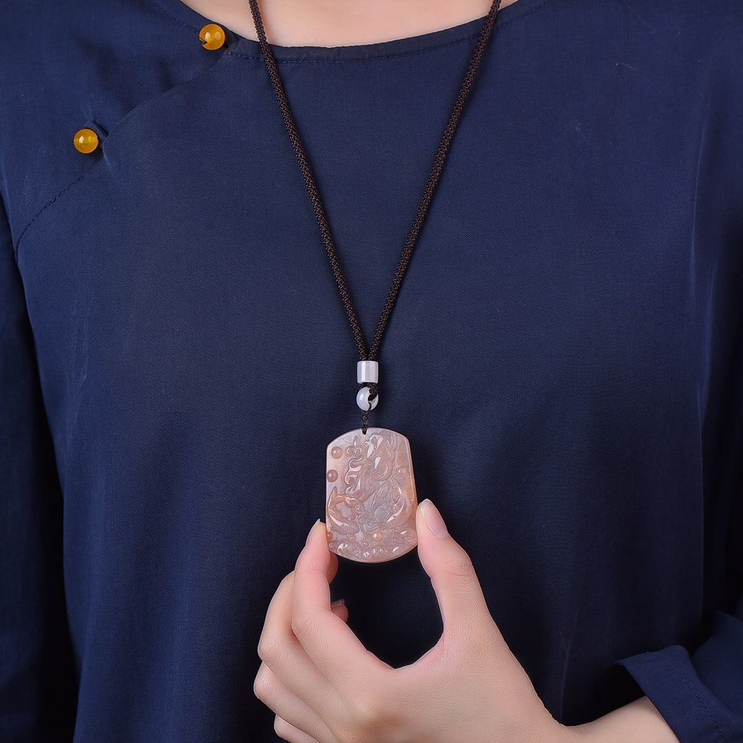 An Exquisite Red Jade Flower Pattern Pendant: An Exquisite Red Jade Flower Pattern Pendant,Size:38mmx52mm 红玉花卉纹挂件