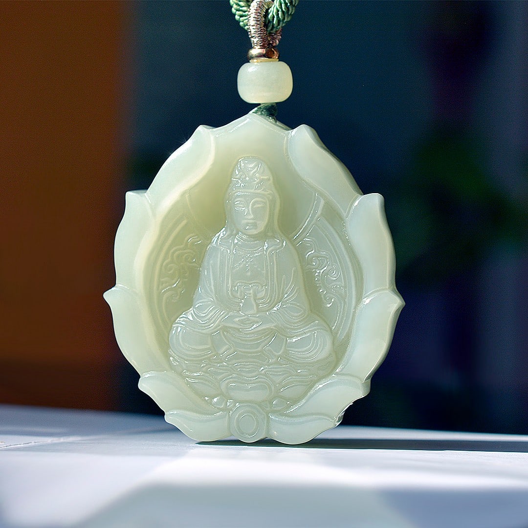 An Exquisite Greenish Jade Statue of Avalokitesvara Pendant: An Exquisite Greenish Jade Statue of Avalokitesvara Pendant,Size:44mmx48mm 青玉观音像挂件
