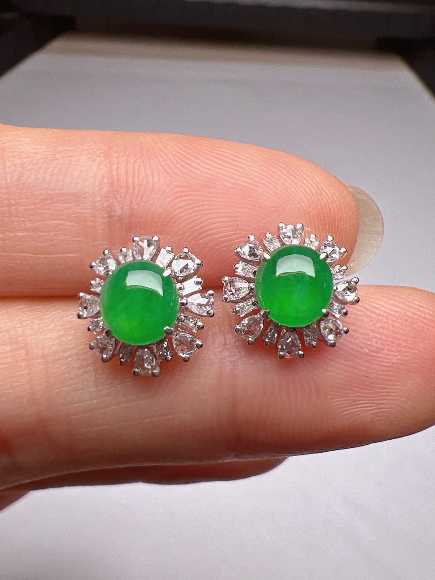 A Pair of Exquisite 18k Gold Diamond Inlaid Jadeite Earrings: A Pair of Exquisite 18k Gold Diamond Inlaid Jadeite Earrings,Size(Loose Stone):5.9mmx5.9mm 一对18k金钻镶嵌翡翠耳钉