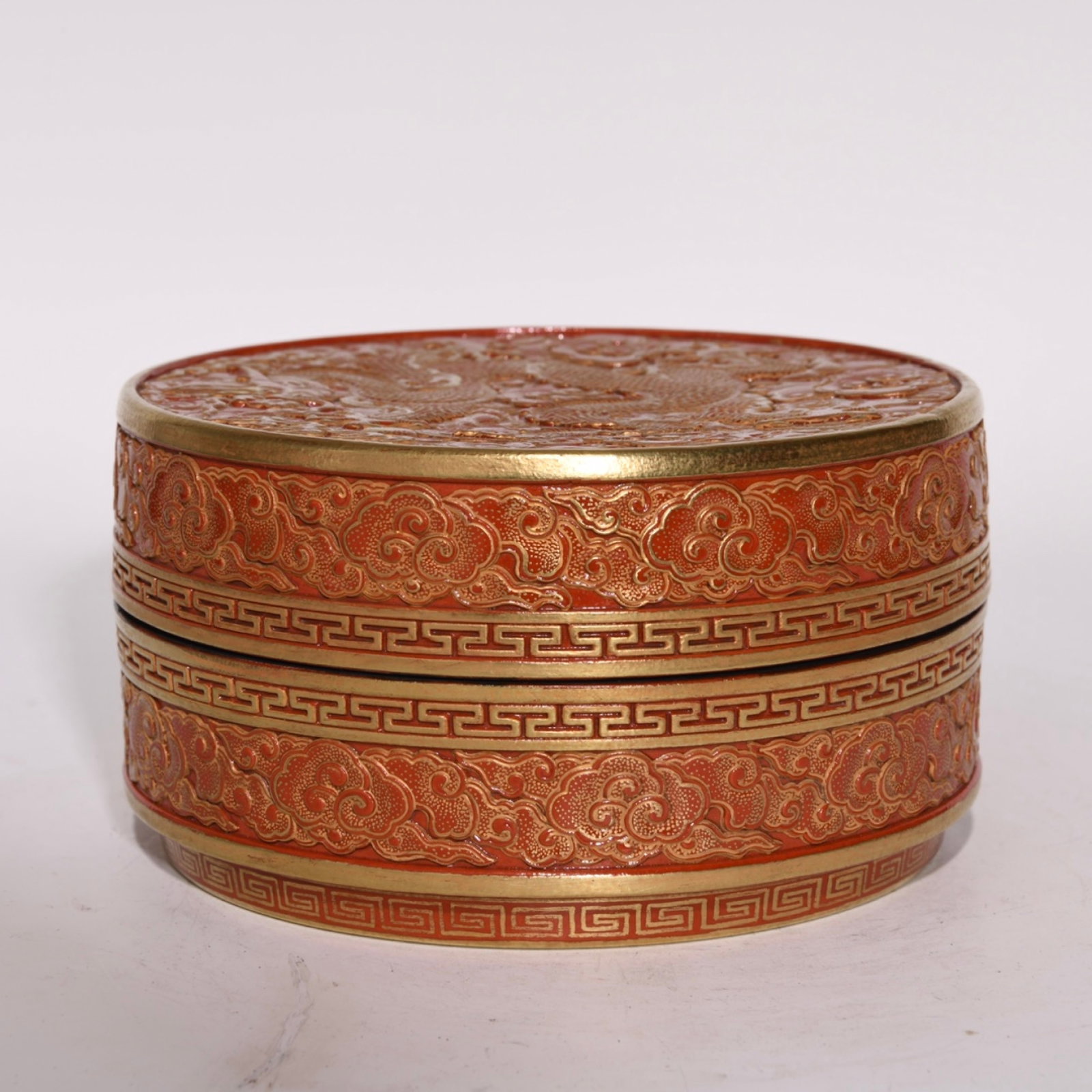 An Exquisite Coral Red Glazed Gilt Auspicious Cloud and Dragon Pattern Box: An Exquisite Coral Red Glazed Gilt Auspicious Cloud and Dragon Pattern Box,Qing Dynasty,China,Qianlong Six-character Mark,Size:3inx5.4in 珊瑚红鎏金祥云龙