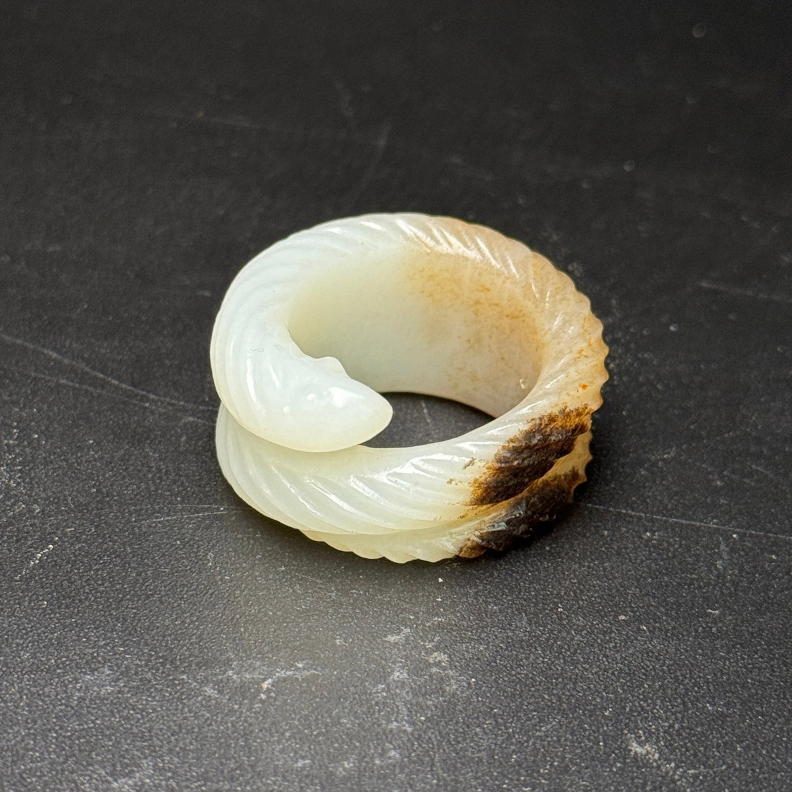 An Exquisite White Jade Snake Patten Thumb Ring: An Exquisite White Jade Snake Patten Thumb Ring,Qing Dynasty,China,Size:35mmx37mmx18mm,Weight:22g 白玉蛇纹扳指,中国清代