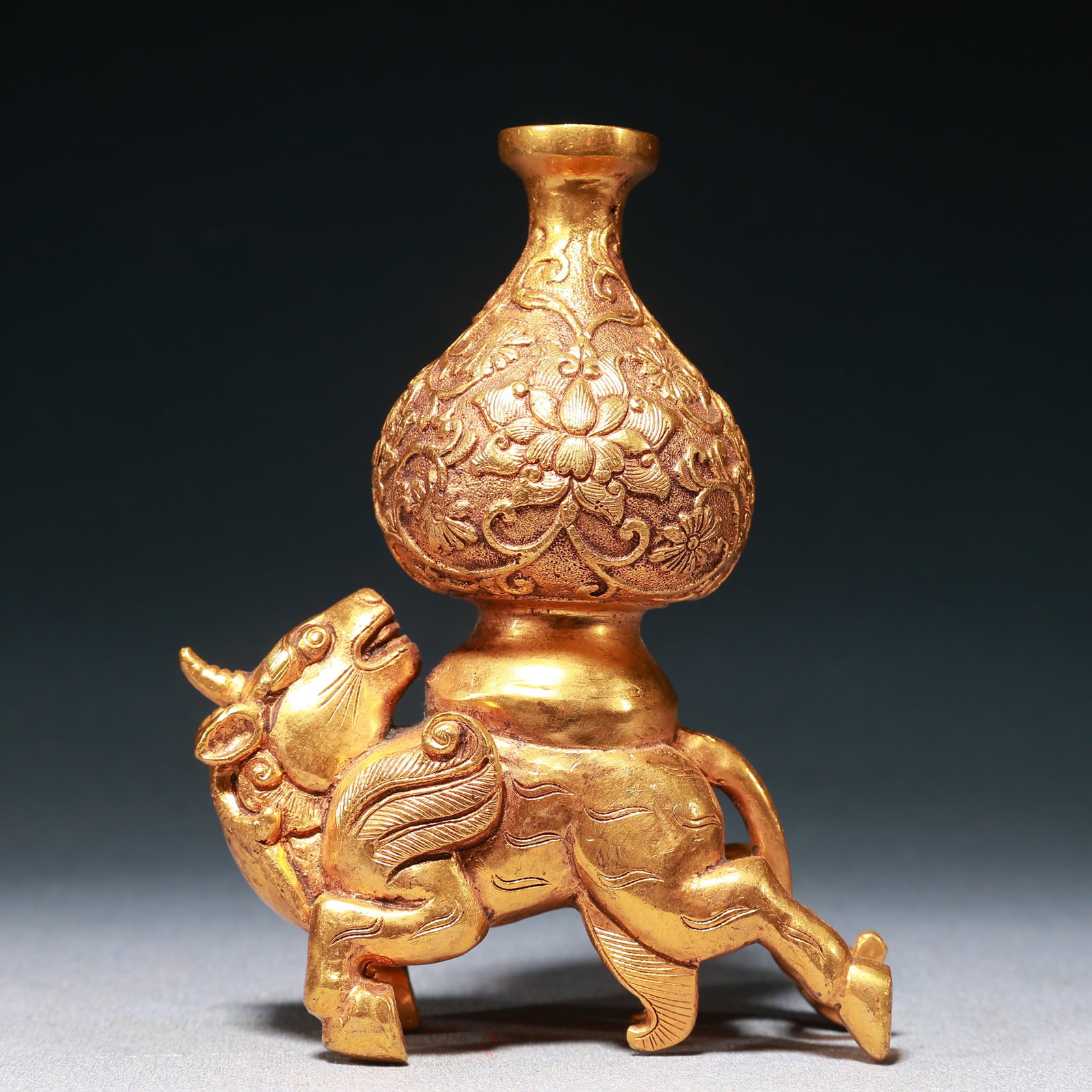 An Exquisite Gilt Bronze Lotus Pattern Vase,With Unicorn Base: An Exquisite Gilt Bronze Lotus Pattern Vase,With Unicorn Base,Qing Dynasty,China,Size:5.3inx2.4inx4.1in,Weight:900g 铜鎏金缠枝莲纹瓶,带独