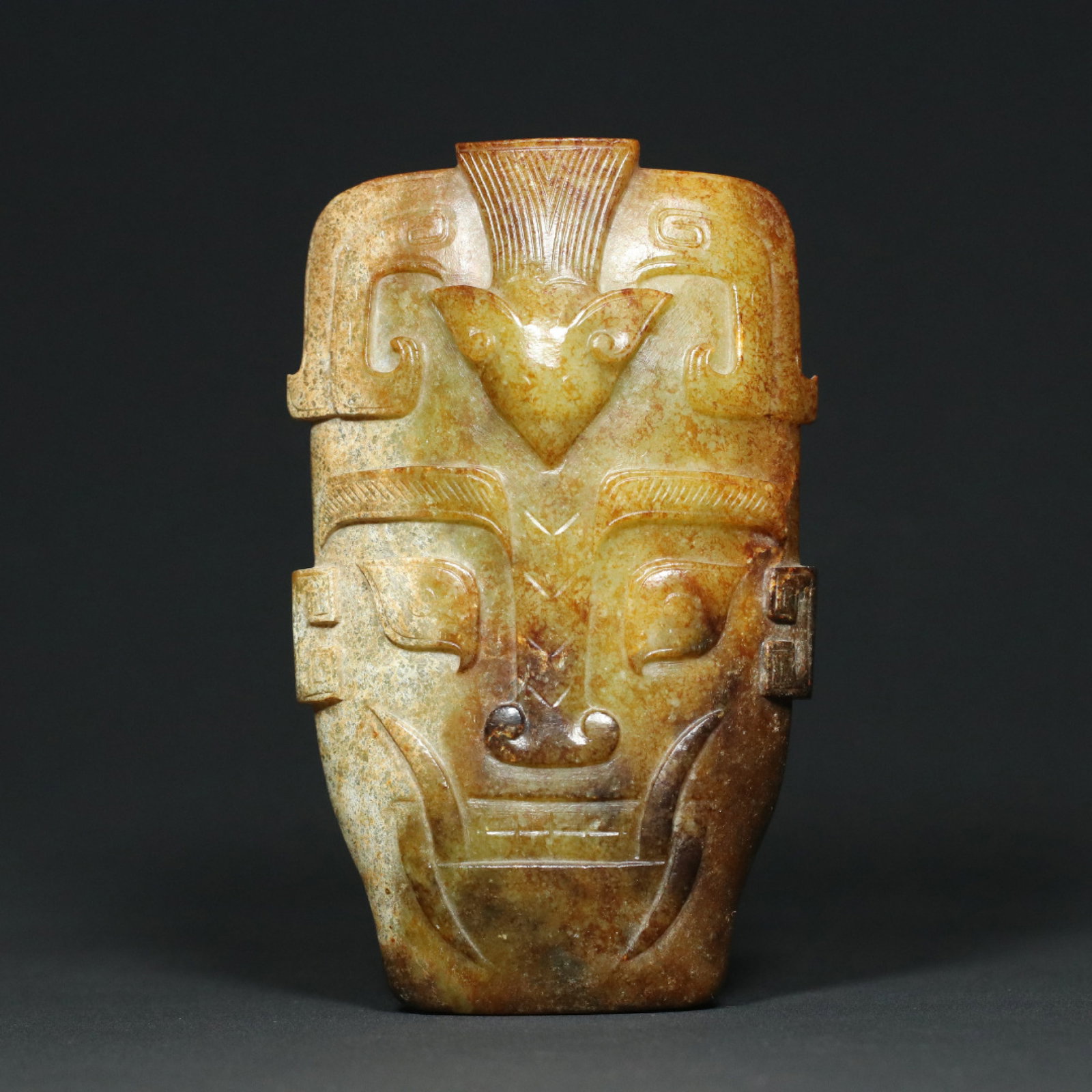 An Exquisite Archaic Jade Figure-Face Pattern Mask,With Inscription: An Exquisite Archaic Jade Figure-Face Pattern Mask,With Inscription,Ancient Time,China,Size:5.6inx3.4inx1.2in,Weight:369.3g 高古玉人面纹面具,带