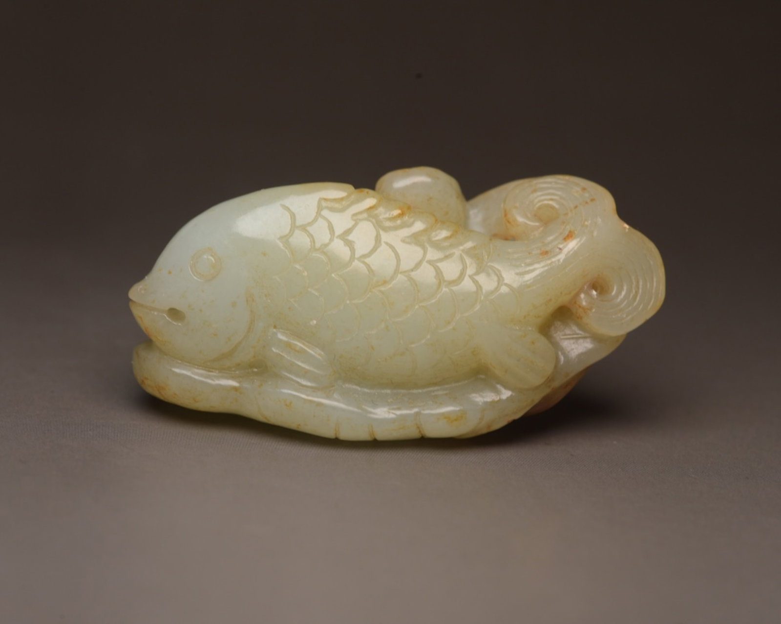 An Exquisite White Jade Fish Ornament: An Exquisite White Jade Fish Ornament,Qing Dynasty,China,Size:2.1inx1.5inx0.9in,Weight:48g 白玉鱼摆件,中国清代