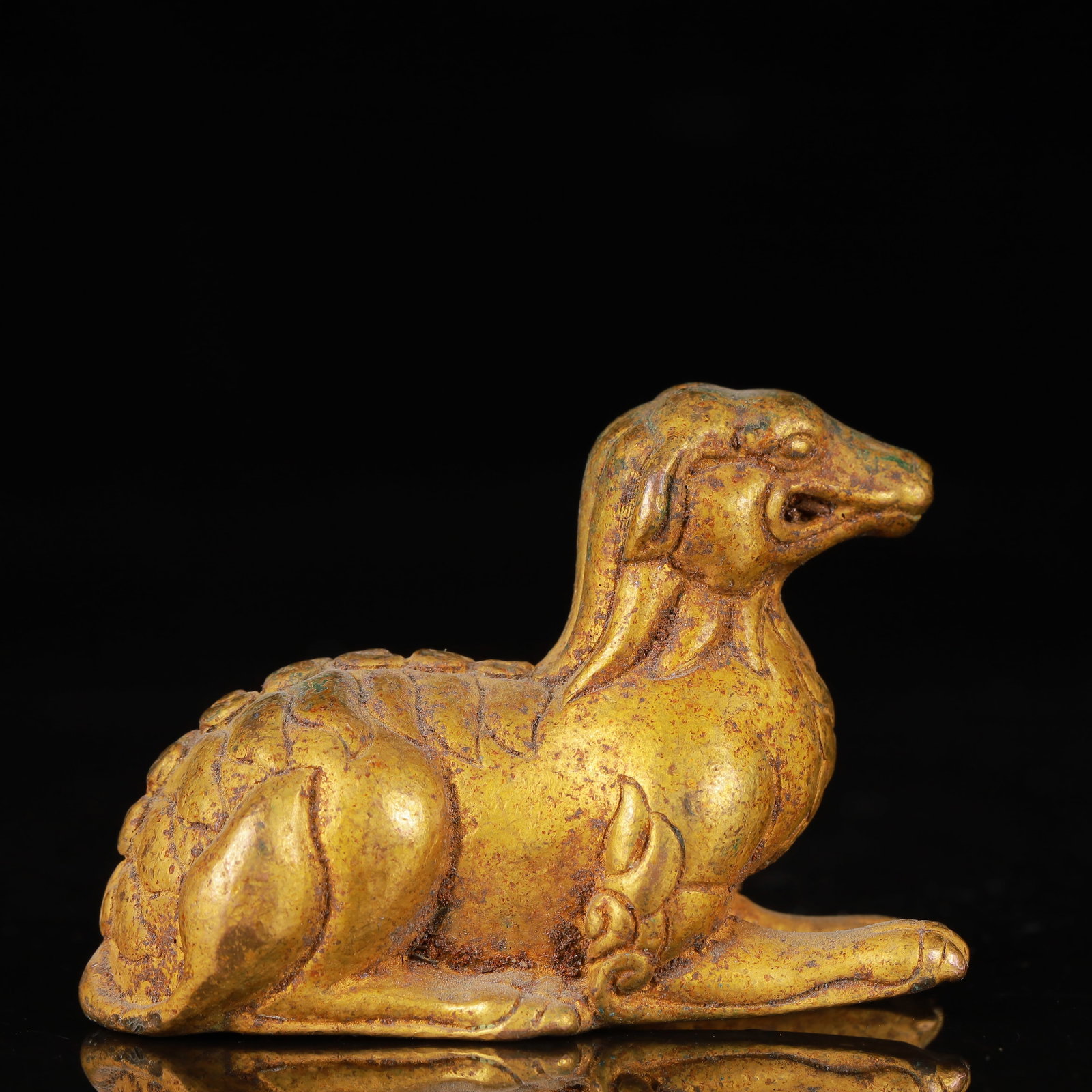 An Exquisite Gilt Bronze Auspicious Beast Ornament: An Exquisite Gilt Bronze Auspicious Beast Ornament,Qing Dynasty,China,Size:2.6inx1.2inx1.8in,Weight:221g 铜鎏金瑞兽摆件,中国清代
