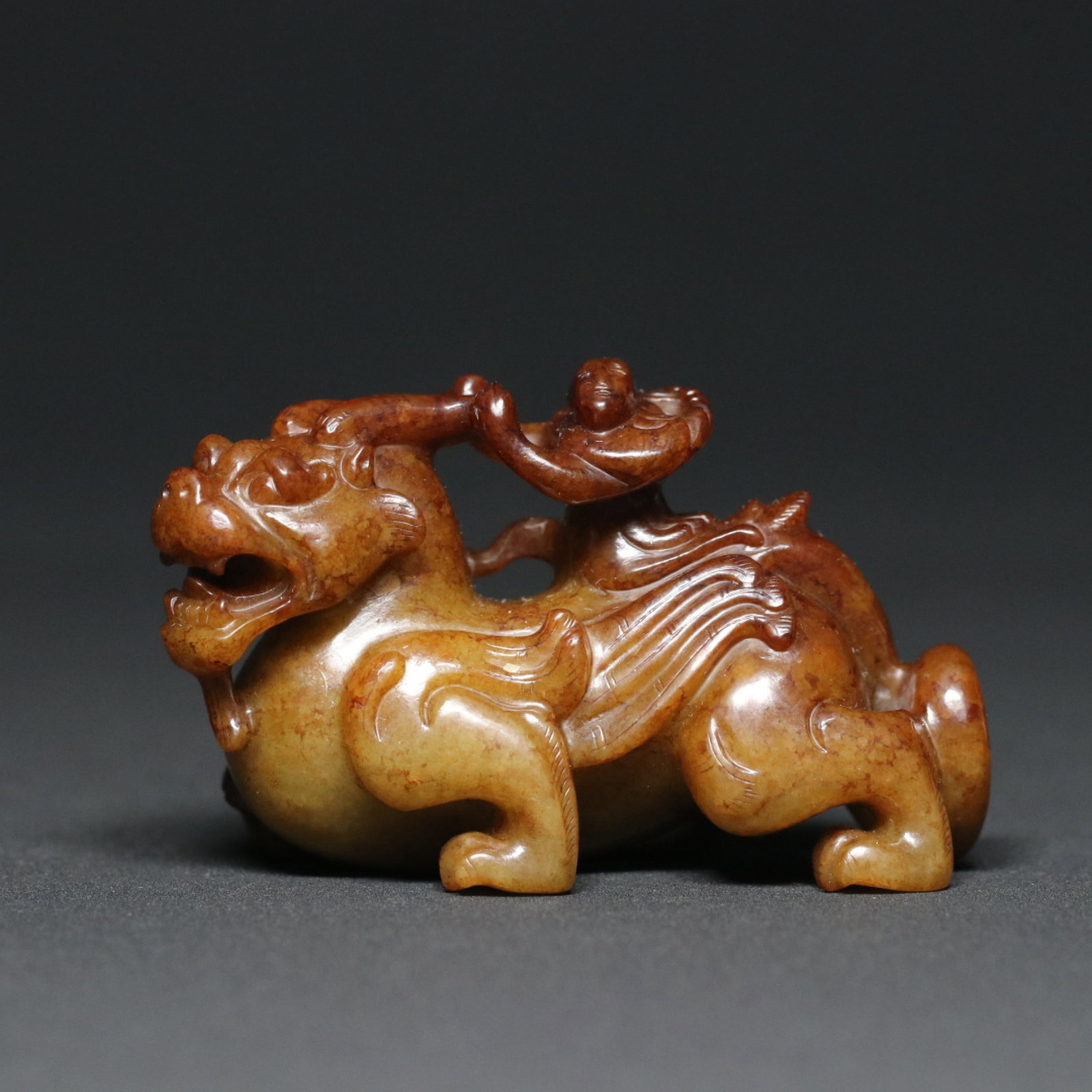 An Exquisite Archaic Jade Auspicious Beast Ornament: An Exquisite Archaic Jade Auspicious Beast Ornament,Han Dynasty,China,Size:3inx1.4inx1.9in,Weight:137.5g 高古玉瑞兽摆件,中国汉代