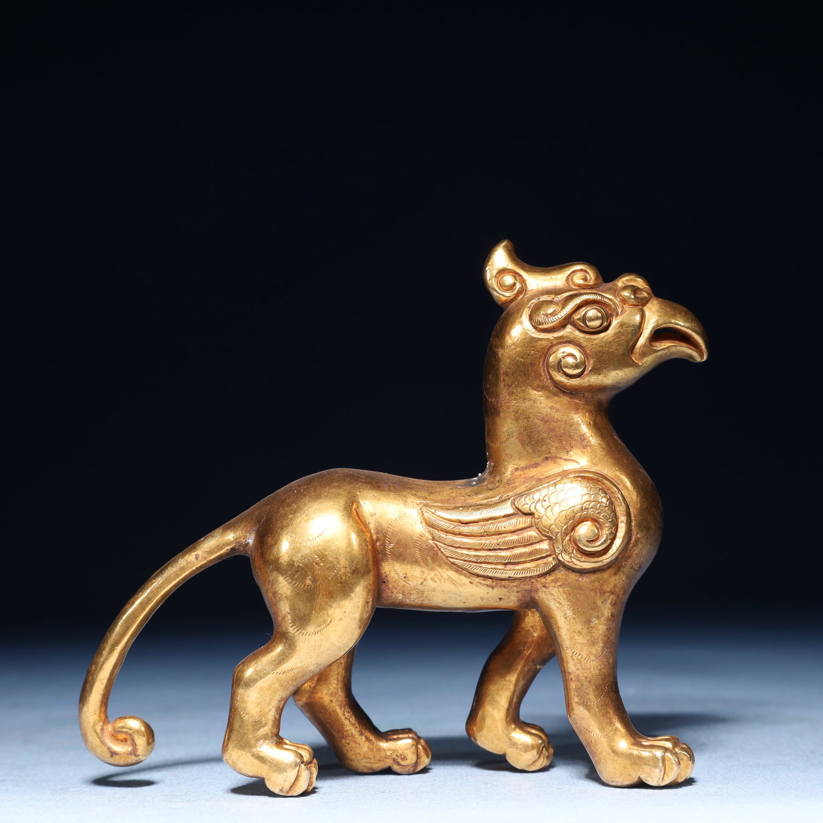 An Exquisite Gilt Bronze Beast Ornament: An Exquisite Gilt Bronze Beast Ornament,Qing Dynasty,China,Size:4.3inx1.6inx3.7in,Weight:750g 铜鎏金兽摆件,中国清代