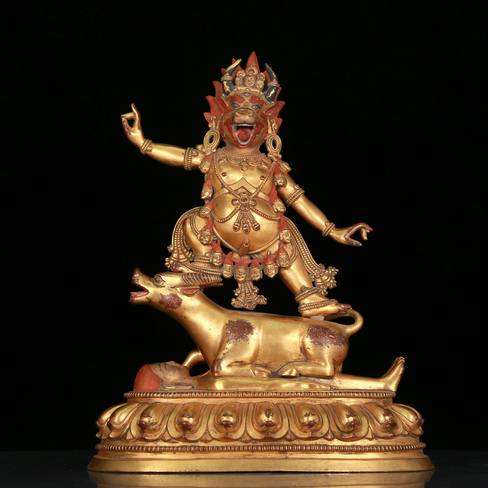 An Elaborate Gilt-Bronze Figure Of Yamantaka Vajrabhairava With Inscriptions: An Elaborate Gilt-Bronze Figure Of Yamantaka Vajrabhairava With Inscriptions. Stood on a mythical beast, body with a potbelly and adorned with jewelry ornaments, all above a lain figure. Chinese Ming
