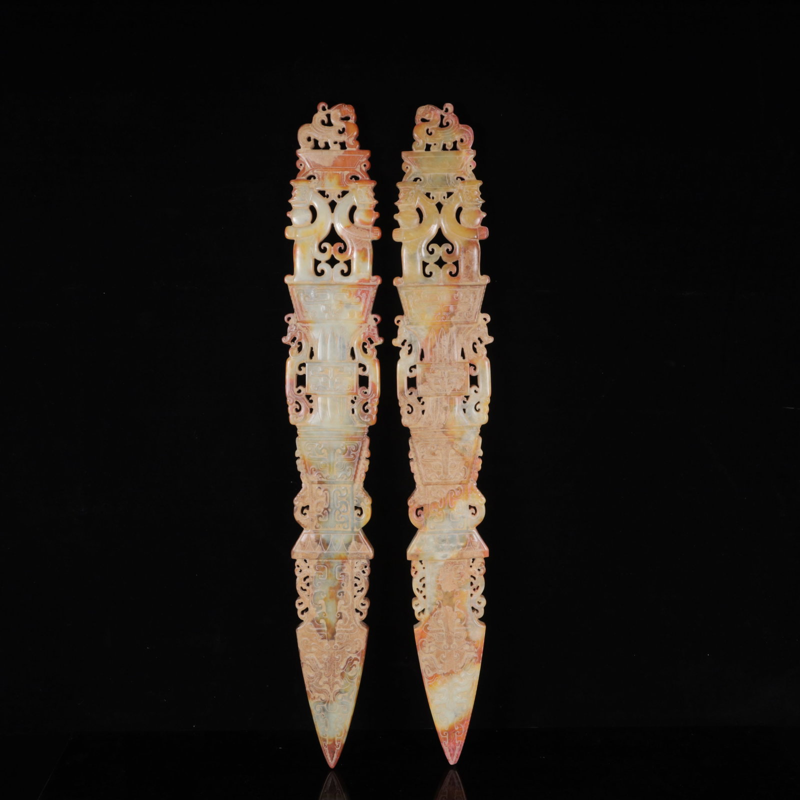 A Pair of Exquisite White Jade Figure-Face Pattern Swords: A Pair of Exquisite White Jade Figure-Face Pattern Swords ,Qing Dynasty,China,Size:3.9inx0.8inx27.6in,Weight:4500g 一对白玉人面纹剑,中国