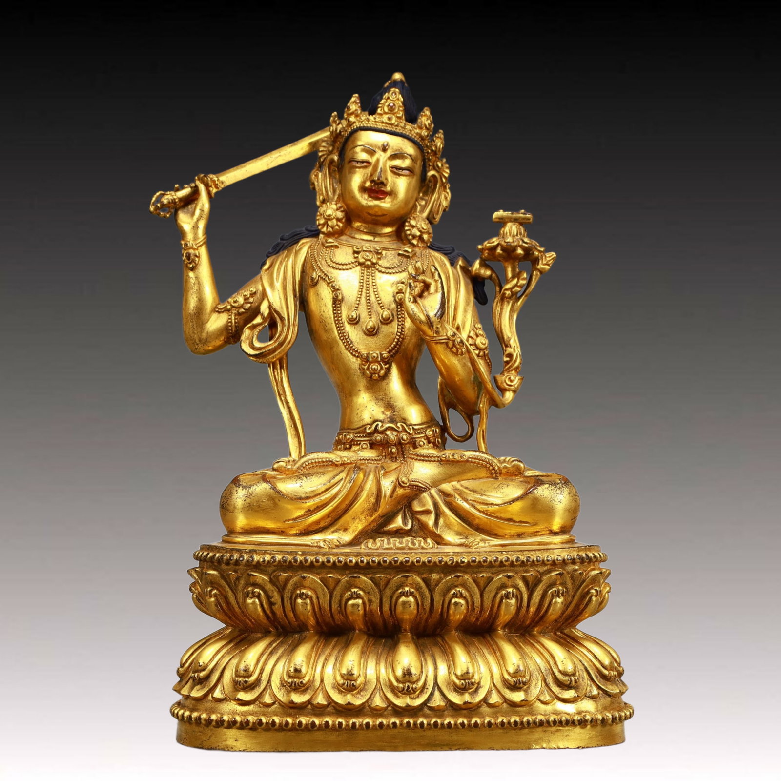 A Solemn Gilt Bronze Statue of Manjusri: A Solemn Gilt Bronze Statue of Manjusri,Ming Dynasty, China, Yongle Six-character Mark,Size:8.3inx5.7inx13.2in,Weight:4950g 铜鎏金文殊菩萨像,中