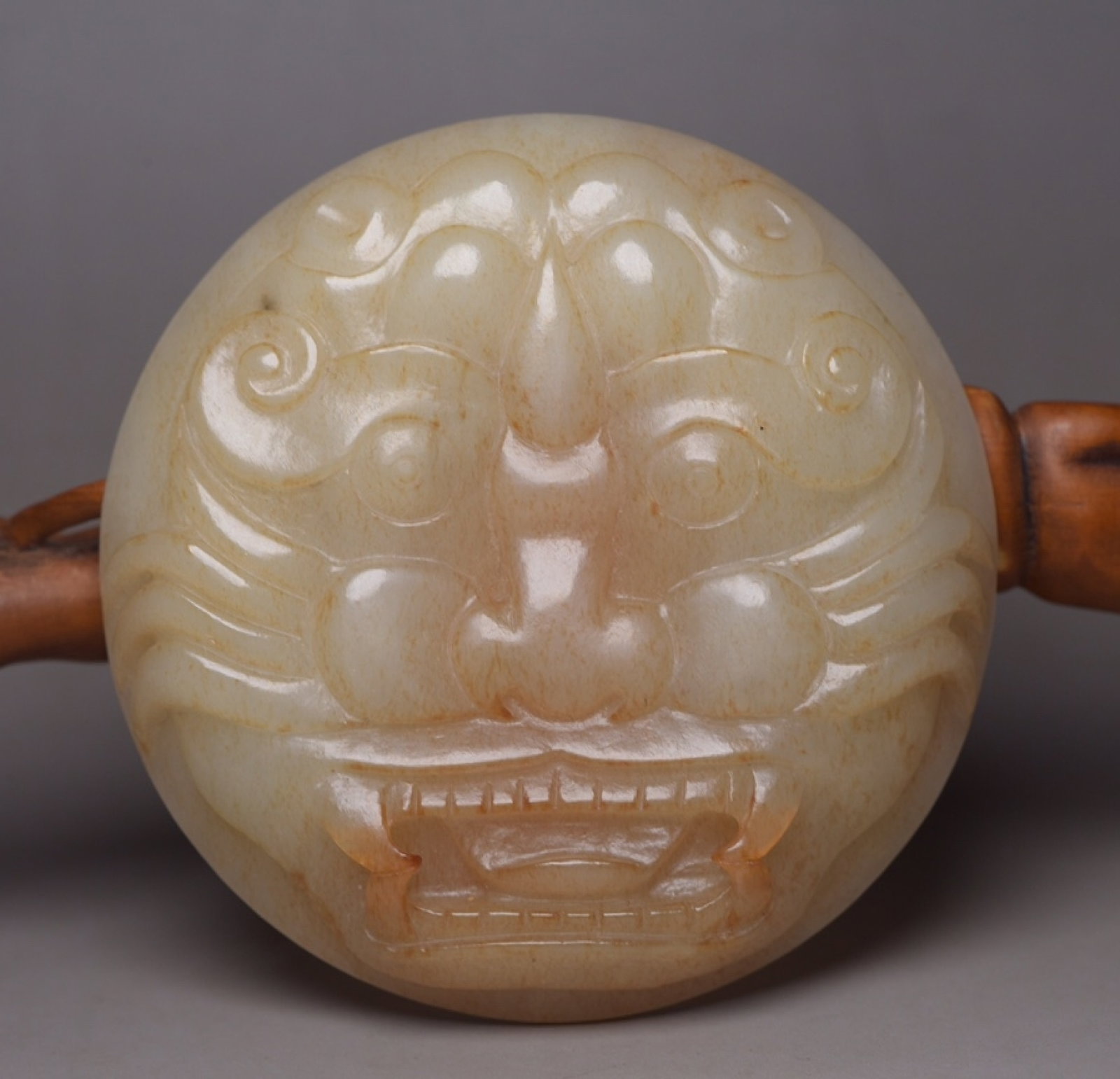 An Exquisite White Jade Beast-Face Pattern Buckle: An Exquisite White Jade Beast-Face Pattern Buckle,Qing Dynasty,China,Size:3inx29.5inx0.5in,Weight:86g 白玉兽面纹腰带扣,中国清代