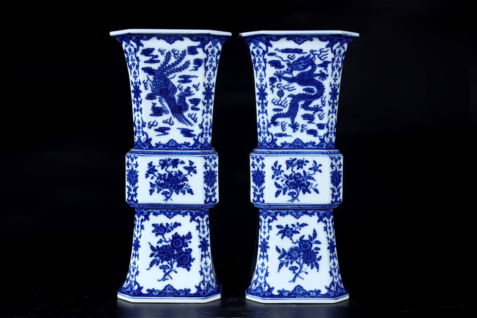A Pair of Exquisite Blue and White Dragon and Phoenix Pattern Vases: A Pair of Exquisite Blue and White Dragon and Phoenix Pattern Vases,Qing Dynasty,China,Qianlong Six-character Mark,Size:19.7inx7.2in 一对青花龙凤纹瓶,&#
