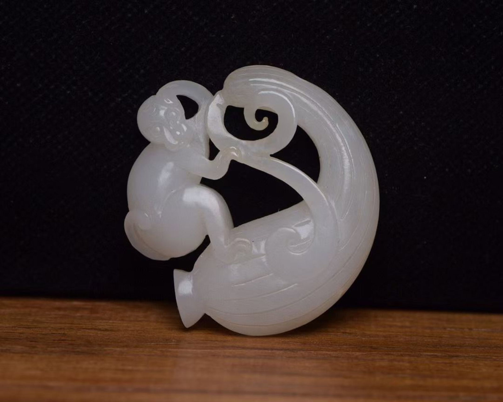 An Exquisite White Jade Monkey Pendant: An Exquisite White Jade Monkey Pendant,Qing Dynasty,China,Size:2.1inx2inx0.5in,Weight:38g 白玉猴子佩,中国清代