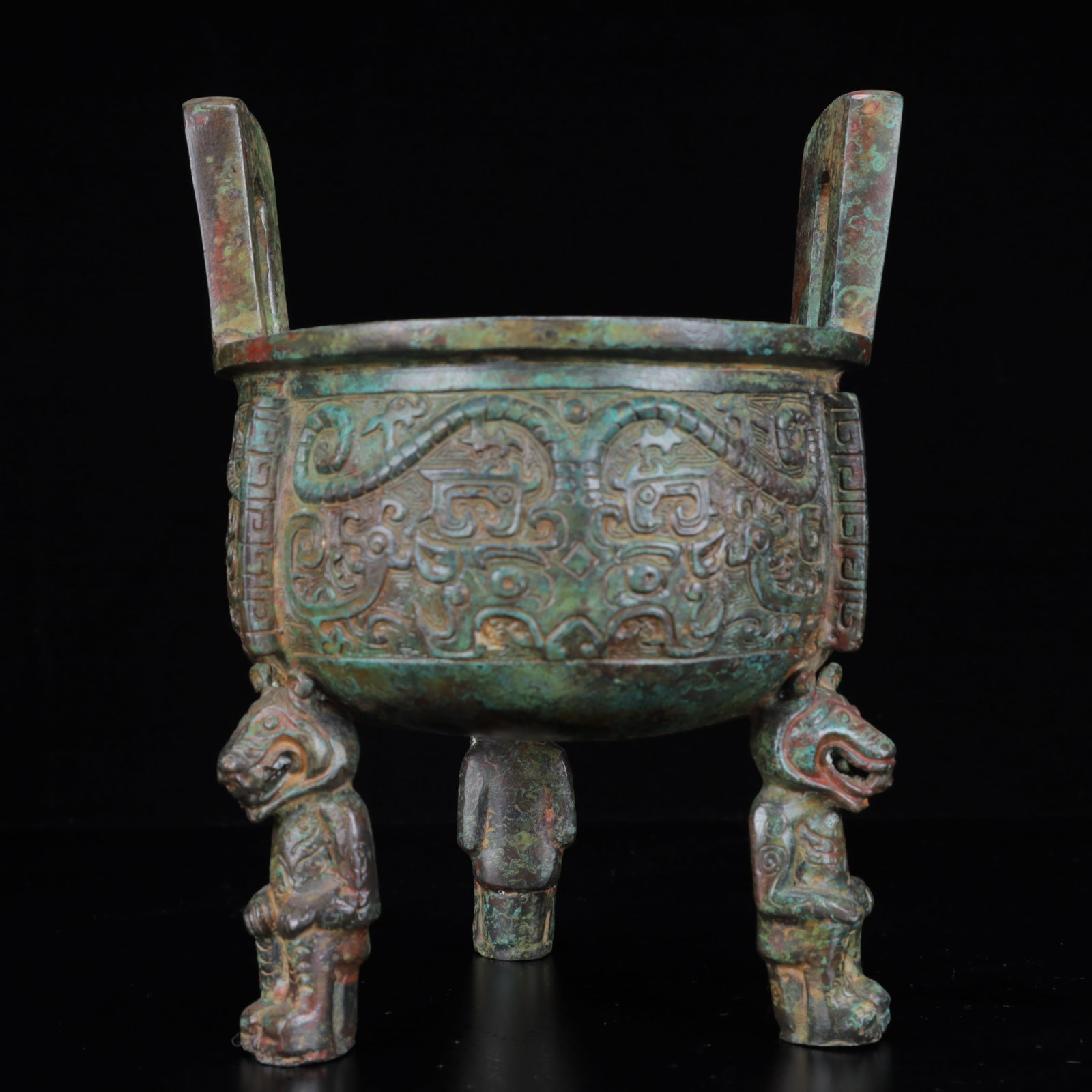 An Archaic Bronze Beast-Face Pattern Double-Ears and Beast Legs Censer: An Archaic Bronze Beast-Face Pattern Double-Ears and Beast Legs Censer,the Warring States Period in China,Size:6.3inx9.1in,Weight:2000g 青铜兽面纹双耳兽