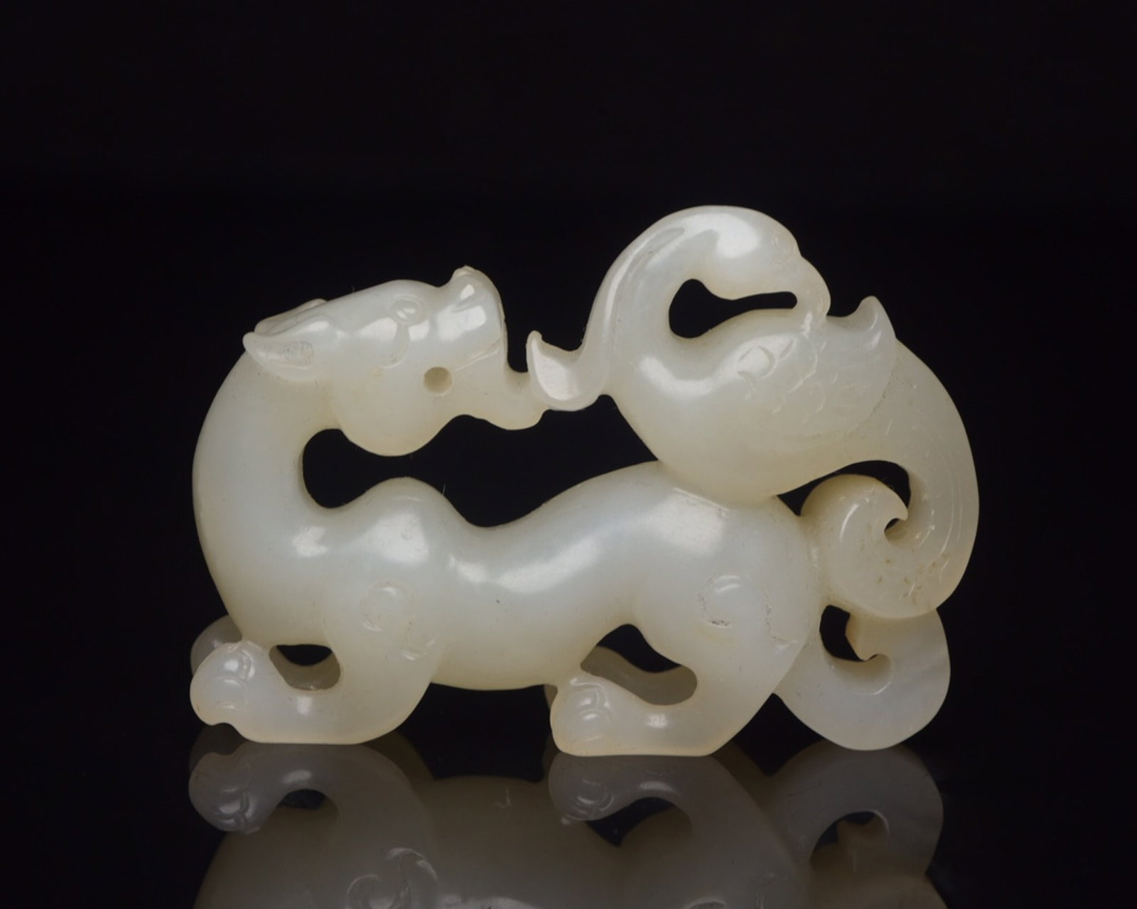 An Exquisite White Jade Dragon and Phoenix Ornament: An Exquisite White Jade Dragon and Phoenix Ornament,Qing Dynasty,China,Size:2.4inx1.6inx0.5in,Weight:41g 白玉龙凤摆件,中国清代