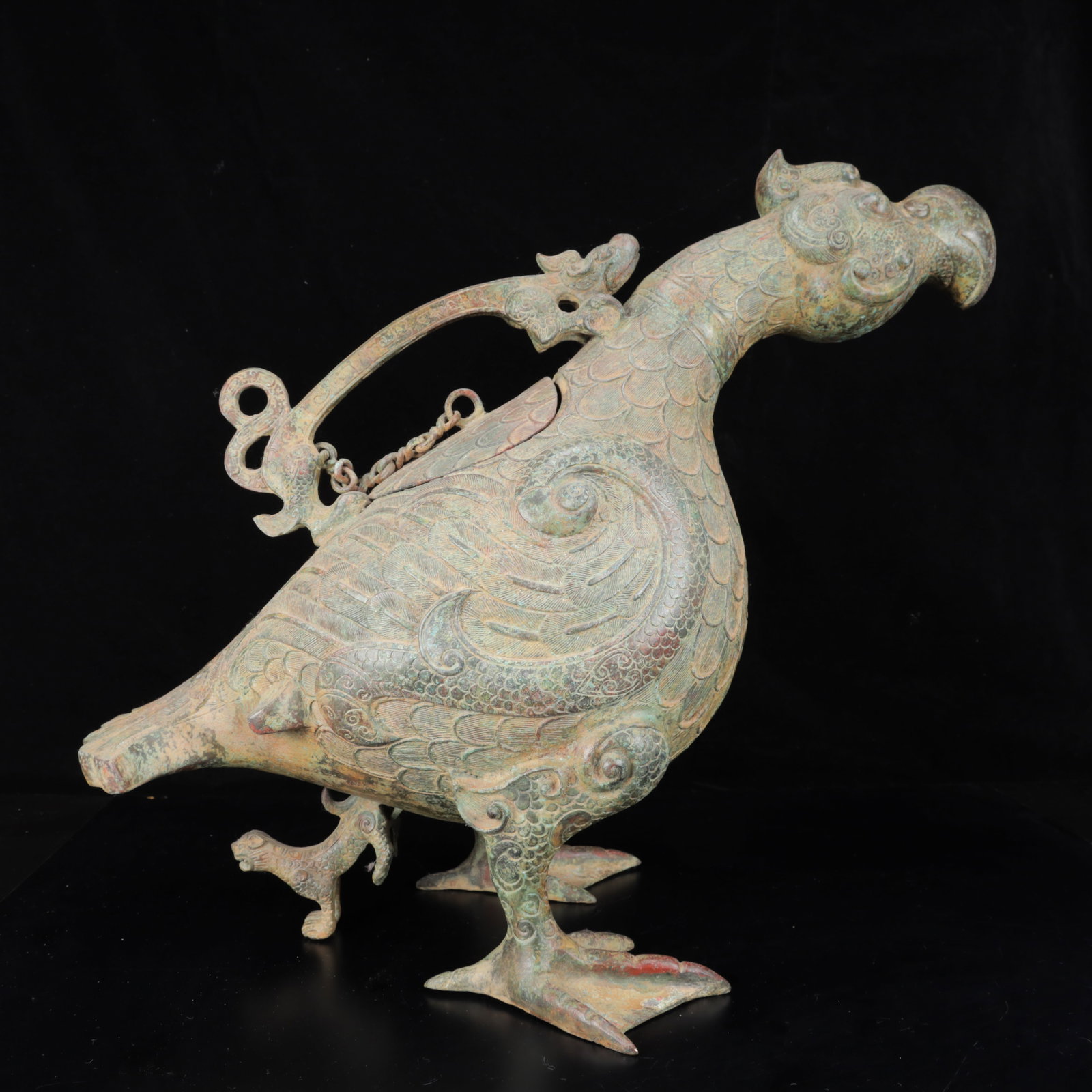 An Archaic Bronze Duck Tripod Zun: An Archaic Bronze Duck Tripod Zun,The Warring States period in China,Size:25.2inx12.2inx19.7in,Weight:9050g 青铜鸭三足尊,中国战国时
