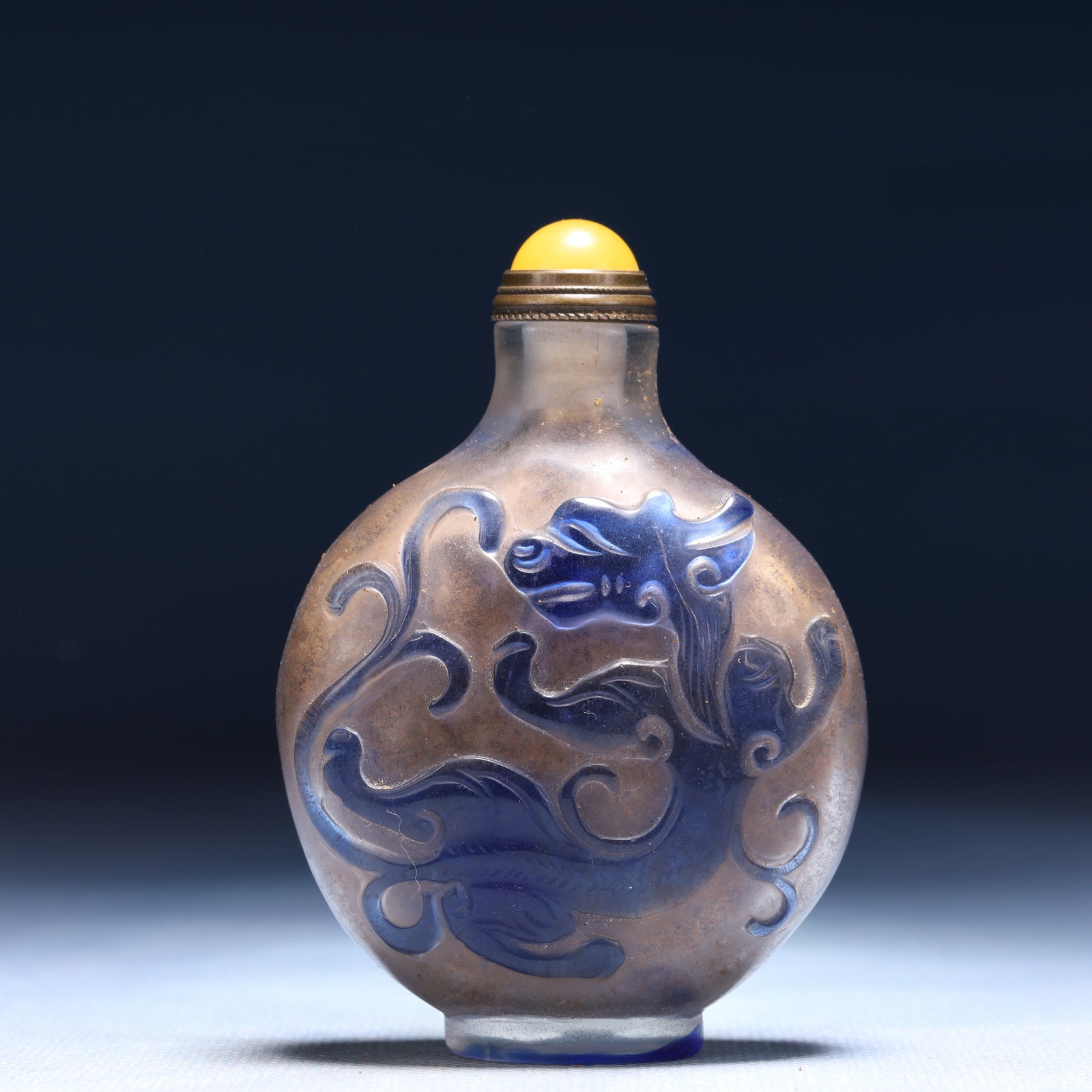 An Exquisite Glass Chi-Dragon Pattern Snuff Bottle: An Exquisite Glass Chi-Dragon Pattern Snuff Bottle,Qing Dynasty,China,Size:2.2inx1inx3.1in,Weight:73g 琉璃螭龙纹鼻烟壶,中国清代