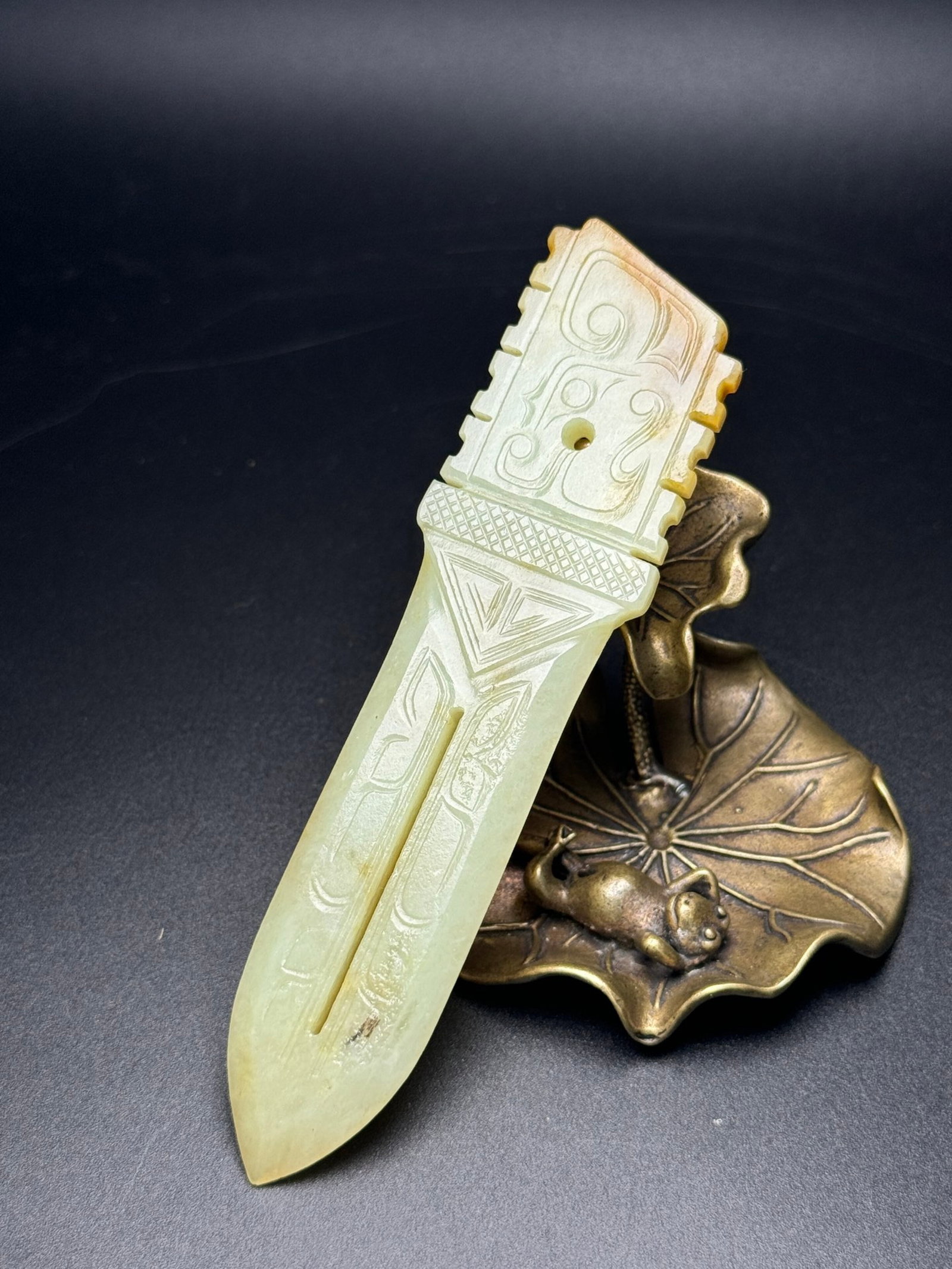 An Exquisite White Jade Sword: An Exquisite White Jade Sword,Qing Dynasty,China,Size:128mmx32mmx6mm,Weight:46g 白玉刀,中国清代