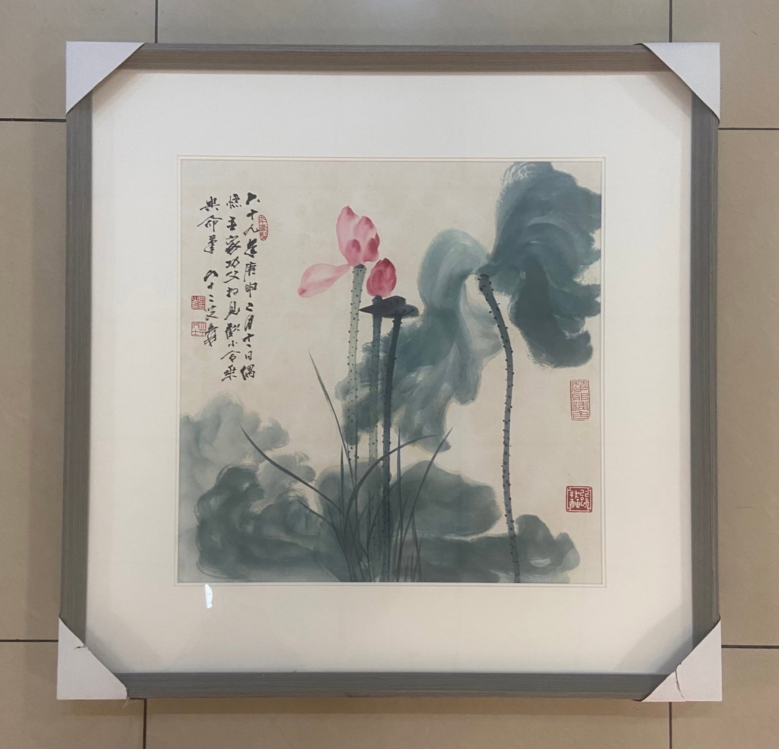 A Chinese Ink Painting of Lotus on Paper with Frame: A Chinese Ink Painting of Lotus on Paper with Frame,Zhang Daqian,Size:(Without frame)19.7inx19.7in,(with Frame)28.7inx28.7in 一幅中国水墨荷花画