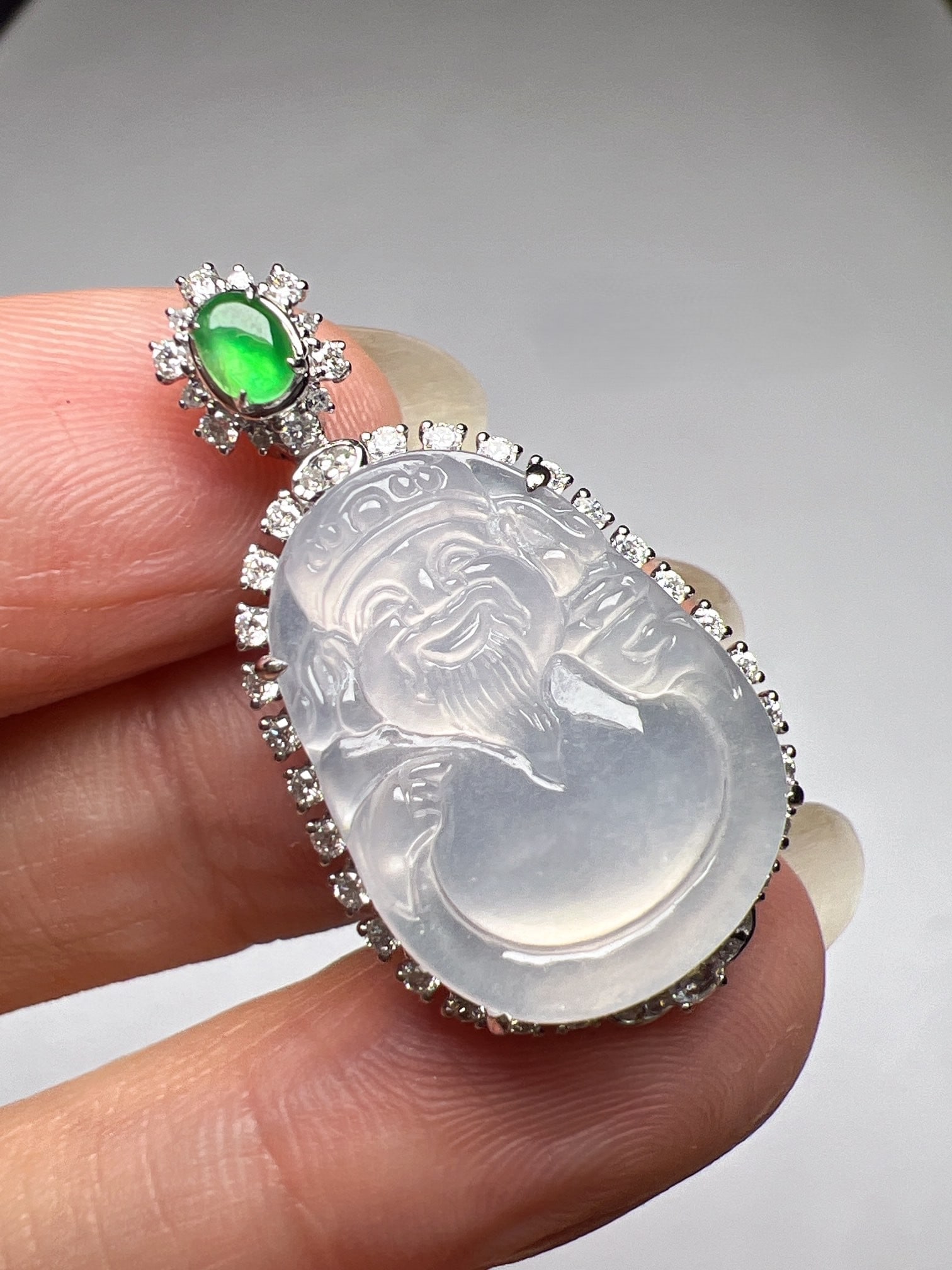 An Exquisite 18k Gold Diamond Inlaid Jadeite Pendant: An Exquisite 18k Gold Diamond Inlaid Jadeite Pendant,Size(Loose Stone):19.3mmx14.2mm 18k金钻镶嵌翡翠吊坠
