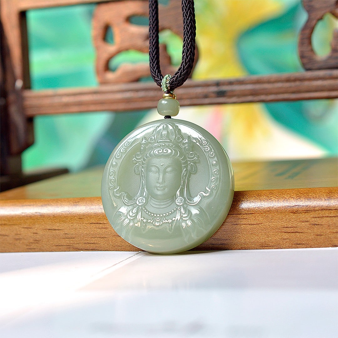 An Exquisite Greenish Jade Statue of Avalokitesvara Pendant: An Exquisite Greenish Jade Statue of Avalokitesvara Pendant,Size:48mmx48mm 青玉观音像挂件
