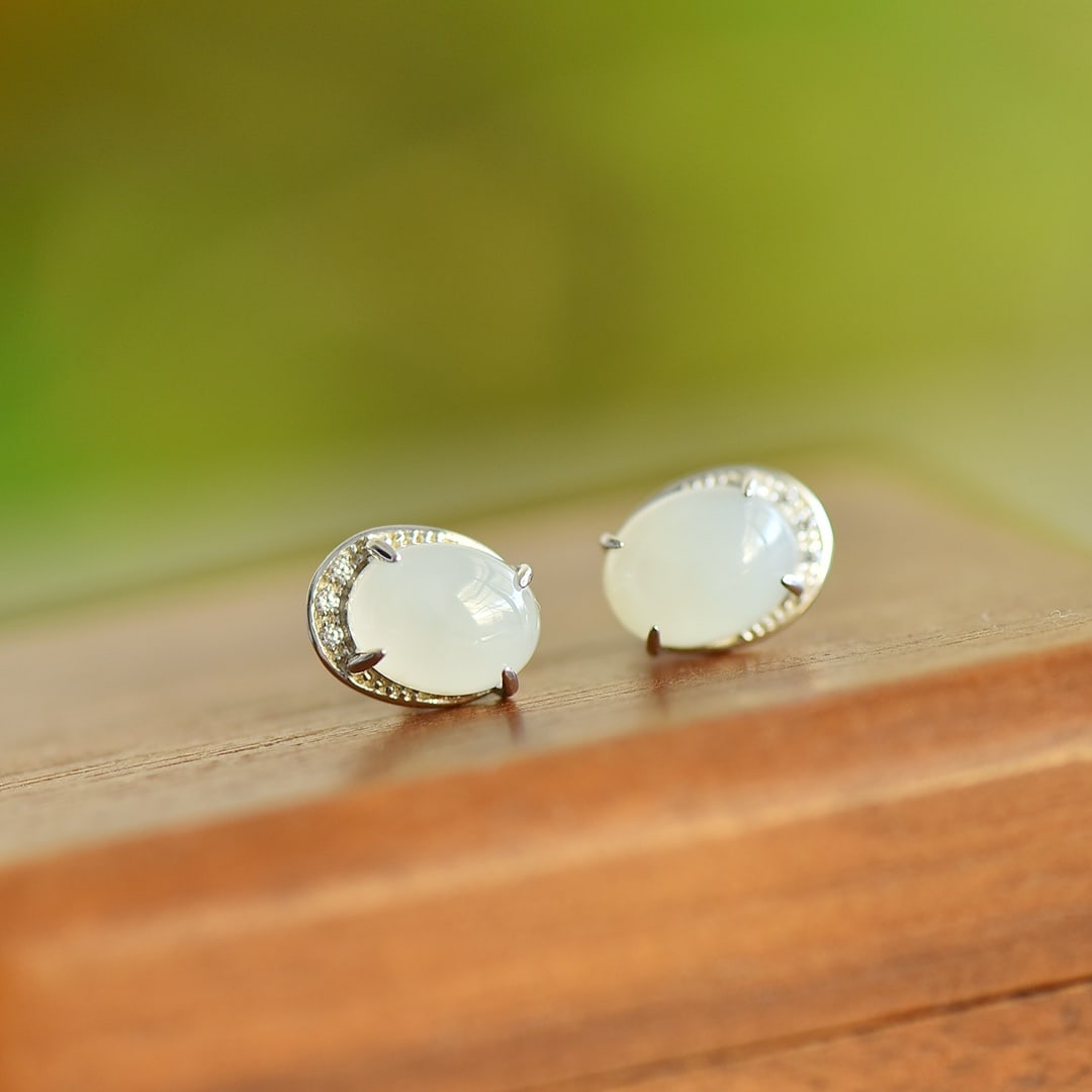 A Pair of Exquisite Sterling Silver Inlaid White Jade Earrings: A Pair of Exquisite Sterling Silver Inlaid White Jade Earrings,Size:7mmx9mm 一对纯银镶白玉耳钉