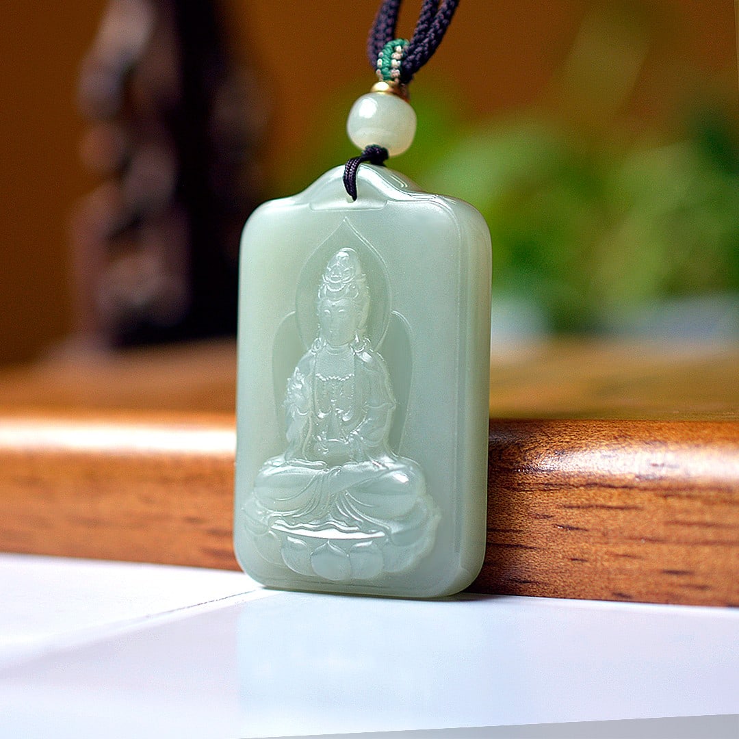 An Exquisite Greenish Jade Statue of Avalokitesvara Pendant: An Exquisite Greenish Jade Statue of Avalokitesvara Pendant,Size:32mmx50mm 青玉观音像挂件