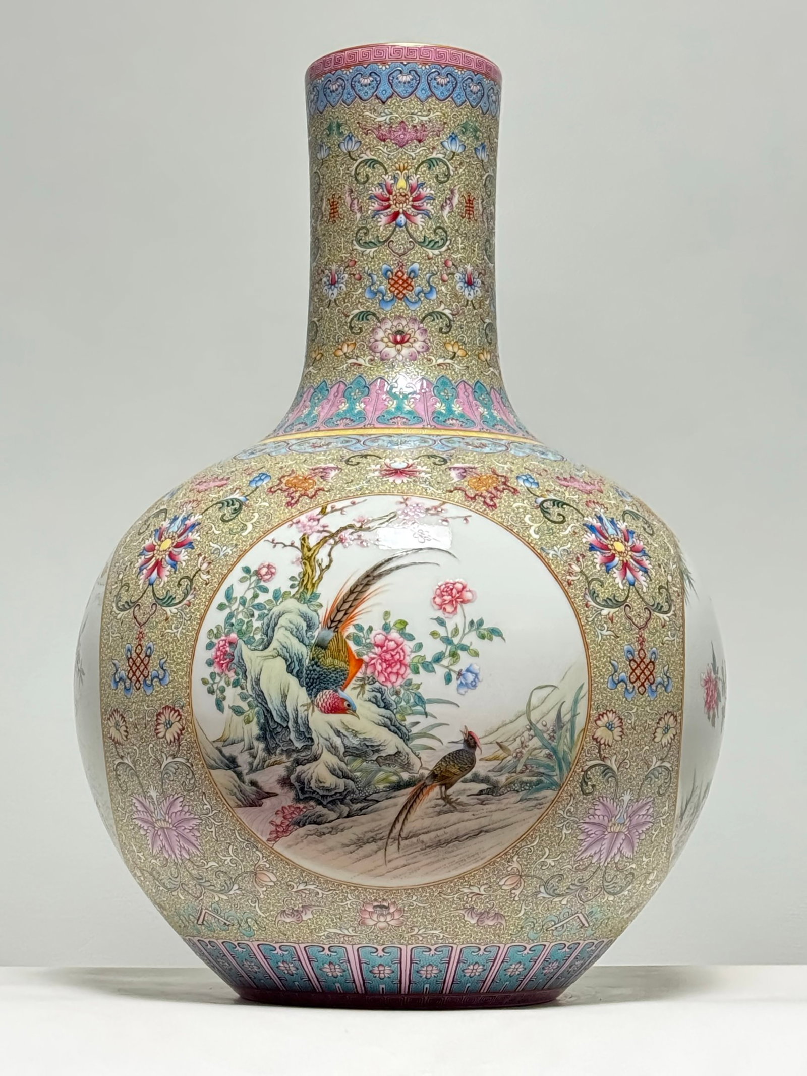 An Exquisite Famille-Rose Yellow Ground Flower and Bird Pattern Vase: An Exquisite Famille-Rose Yellow Ground Flower and Bird Pattern Vase,Qing Dynasty,China,Qianlong Six-character Mark,Size:22inx15.4in 粉彩黄地花鸟纹瓶,&#
