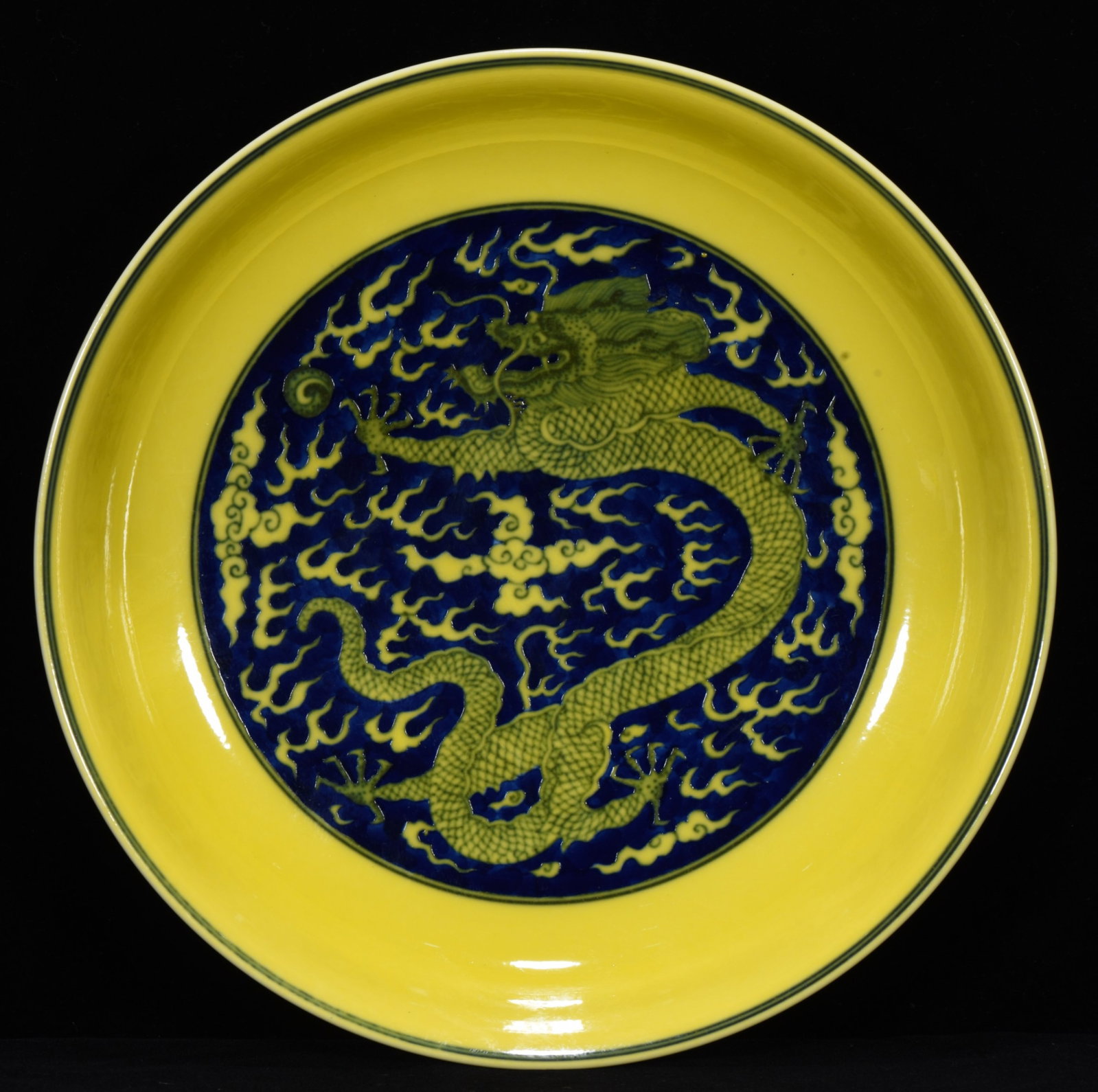 An Exquisite Yellow Glazed Blue and White Auspicious Cloud and Dragon Pattern Plate: An Exquisite Yellow Glazed Blue and White Auspicious Cloud and Dragon Pattern Plate,Qing Dynasty,China,Yongzheng Six-Character Mark,Size:2inx10.2in 黄釉青花祥云(