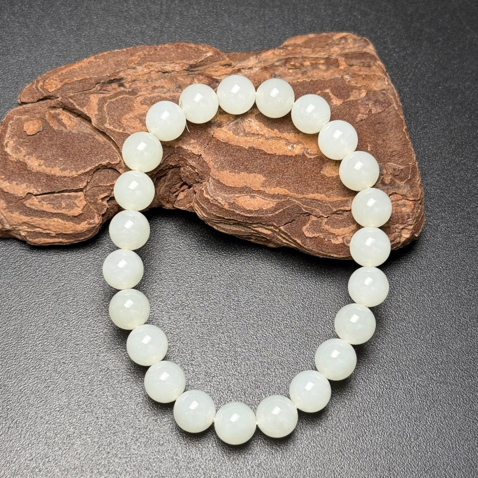 An Exquisite White Jade Bracelet: An Exquisite White Jade Bracelet,Qing Dynasty,China,Size:8mm,Weight:18g 白玉手串,中国清代
