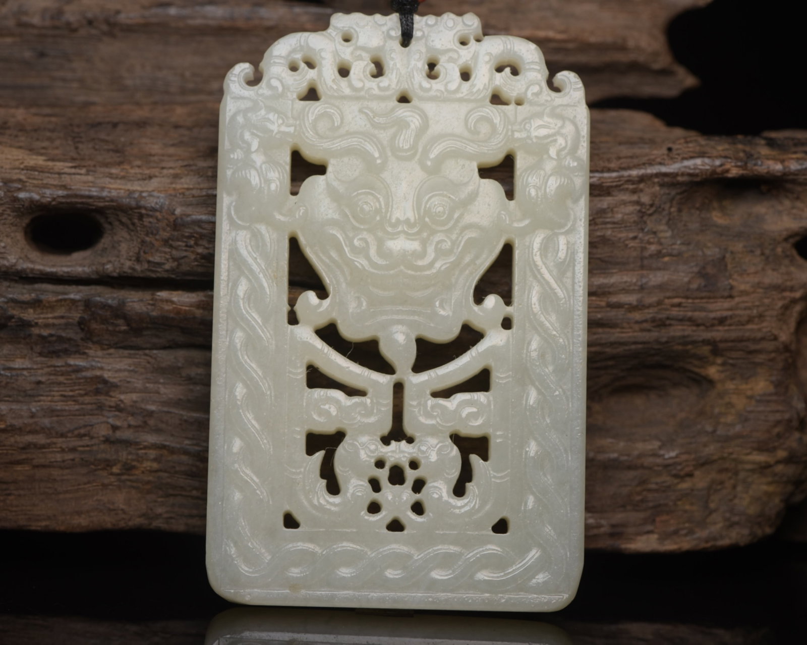 An Exquisite White Jade Beast-Face Pattern Pendant: An Exquisite White Jade Beast-Face Pattern Pendant,Qing Dynasty,China,Size:.3.1inx2inx0.4in,Weight:63g 白玉兽面纹挂件,中国清代
