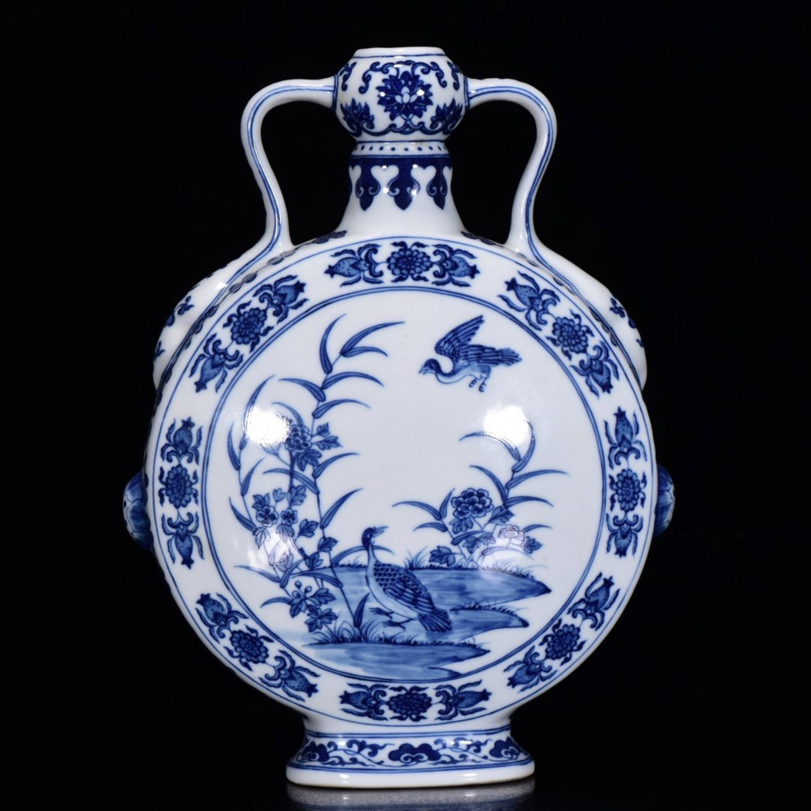 An Exquisite Blue and White Flower and Bird Pattern Double-Ears Vase: An Exquisite Blue and White Flower and Bird Pattern Double-Ears Vase,Qing Dynasty,China,Qianlong Six-Character Mark,Size:11inx8.3in 青花花鸟纹双耳瓶,