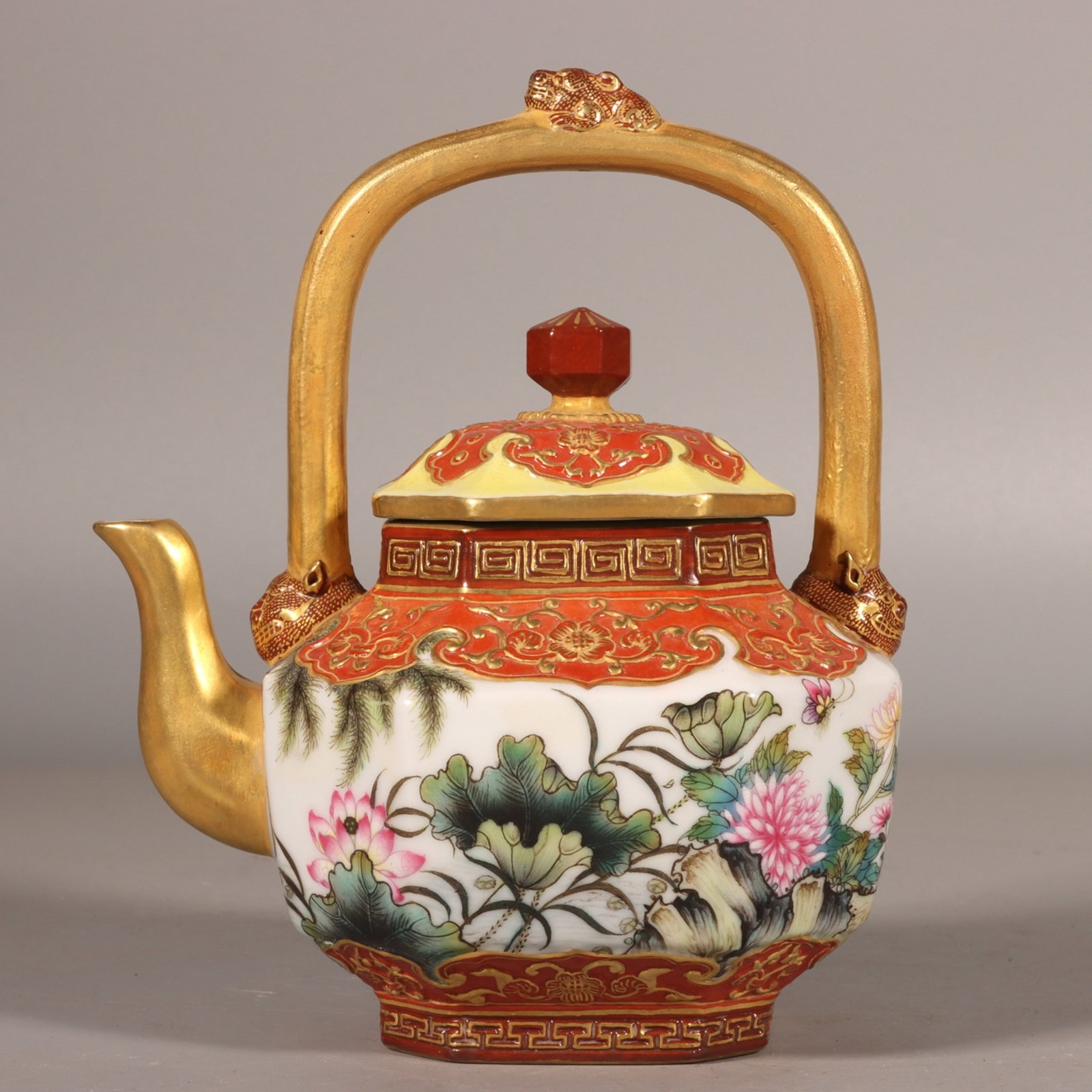 An Exquisite Enamel Iron-Red Painted Gold Flower and Butterfly Pattern Loop-Handled Pot,with poem: An Exquisite Enamel Iron-Red Painted Gold Flower and Butterfly Pattern Loop-Handled Pot,with poem,Qing Dynasty,China,Qianlong Six-character Mark,Size:5.5inx3.5in 珐琅彩矾಩