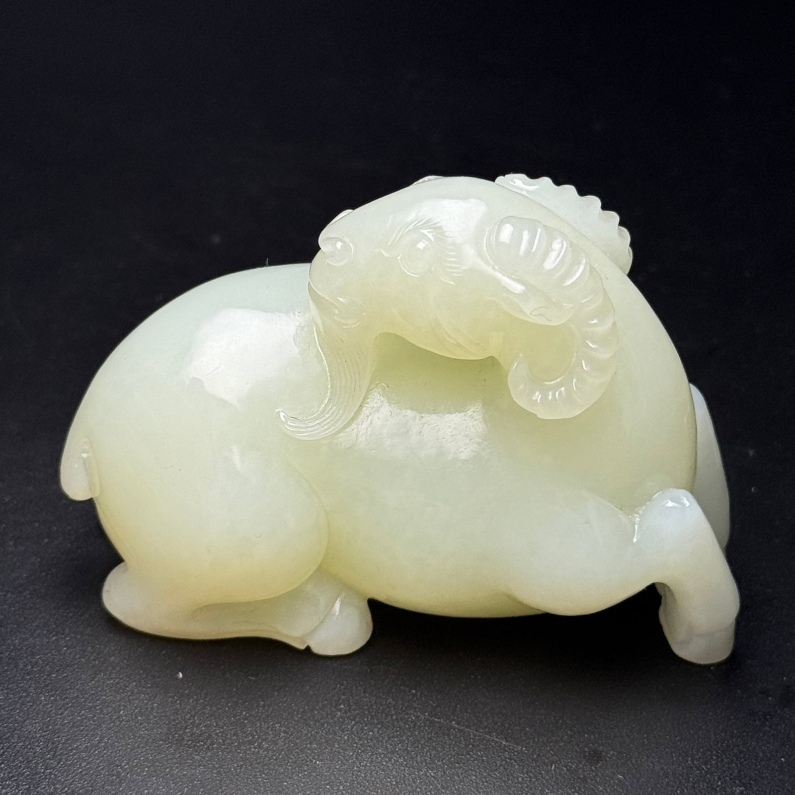 An Exquisite White Jade Sheep Ornament: An Exquisite White Jade Sheep Ornament,Qing Dynasty,China,Size:82mmx63mmx38mm,Weight:224g 白玉羊摆件,中国清代