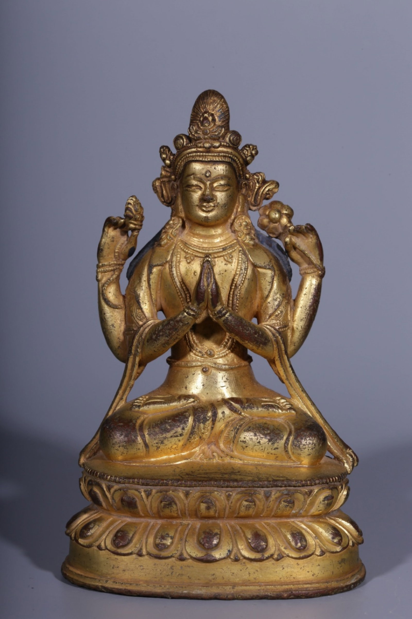 A Rare Gilt Bronze Statue of Four-arms Avalokitesvara: A Rare Gilt Bronze Statue of Four-arms Avalokitesvara,Qing Dynasty, China,Size:5.2inx3.1inx2.3in,Weight:592g 铜鎏金四臂观音像,中国清&#
