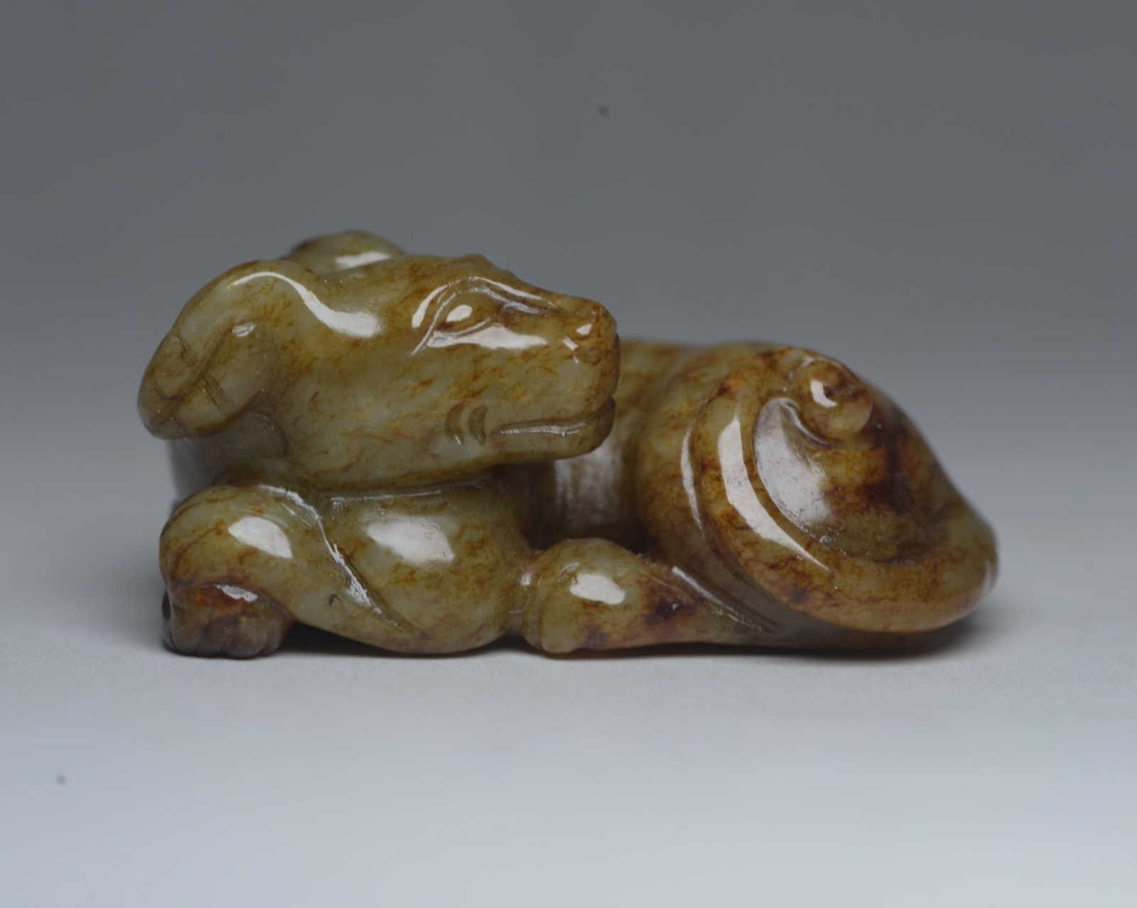 An Exquisite Yellow Jade Dog Ornament: An Exquisite Yellow Jade Dog Ornament,Qing Dynasty,China,Size:2.5inx1.6inx1.1in,Weight:99g 黄玉犬摆件,中国清代